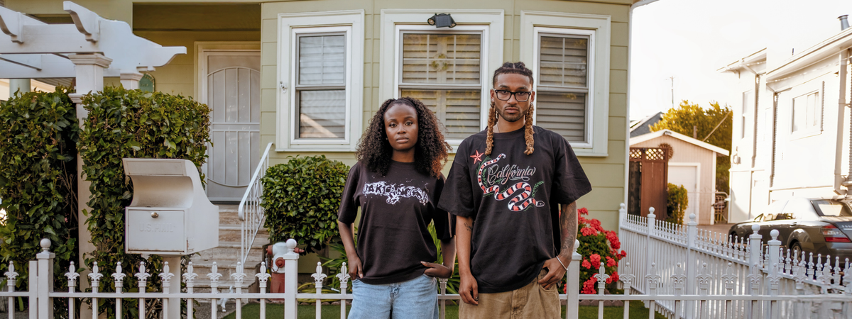 Model wearing town business 2024 tee in black.