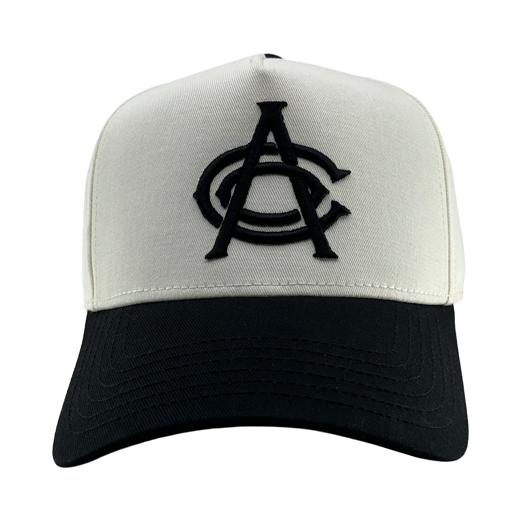 The OAC Logo 5 Panel by OAC is a two-tone snapback cap featuring a white crown, black bill, and bold black embroidered overlapping “CA” letters on the front center. Inspired by classic Oakland Athletic Club style, the cap faces directly forward against a plain white background.