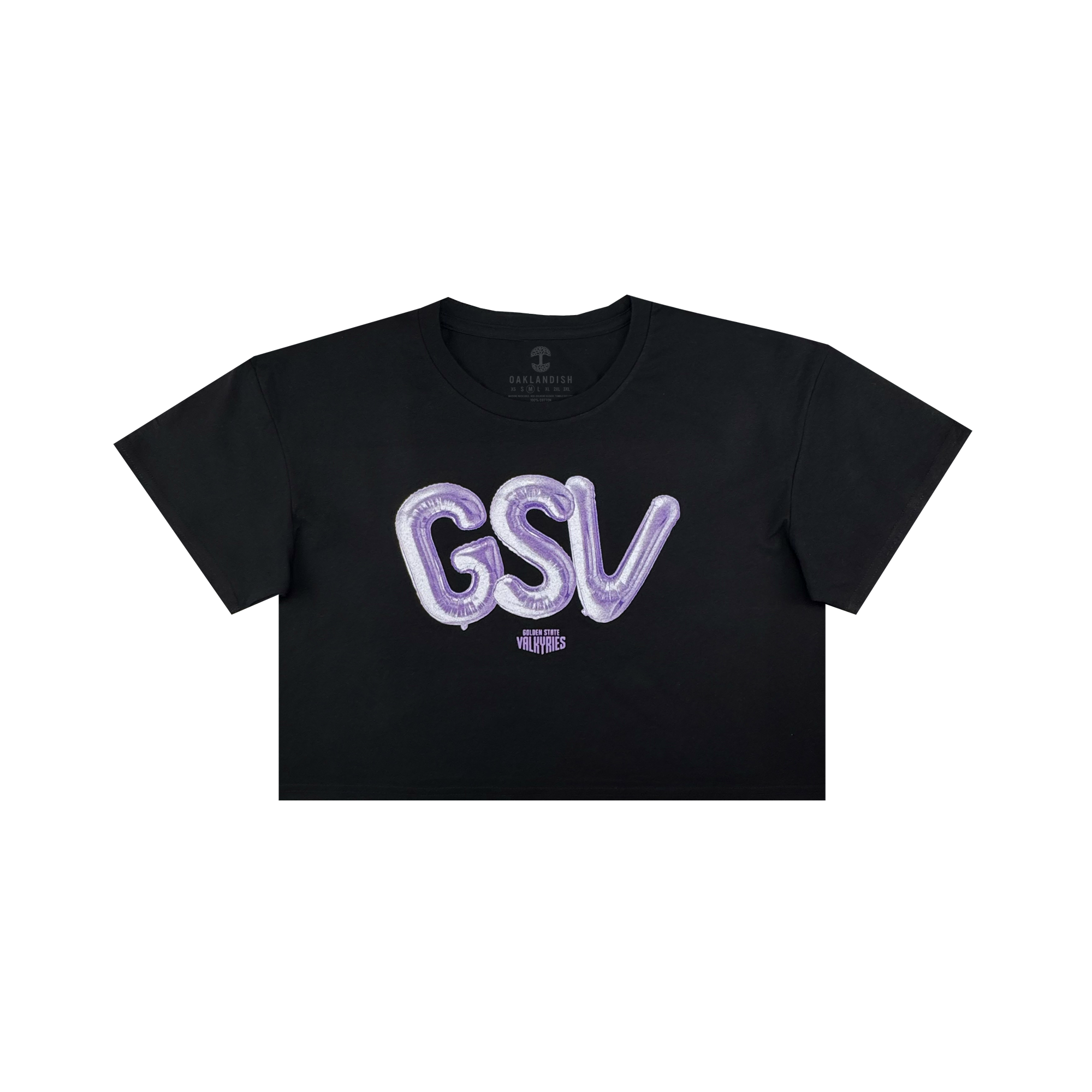 The Women’s Golden State Valkyries Balloons Crop Tee by GSV is a black cropped t-shirt with bold, shiny purple “GSV” balloon letters and a small white “VLVT STUDIOS” logo beneath, inspired by the Golden State Valkyries.