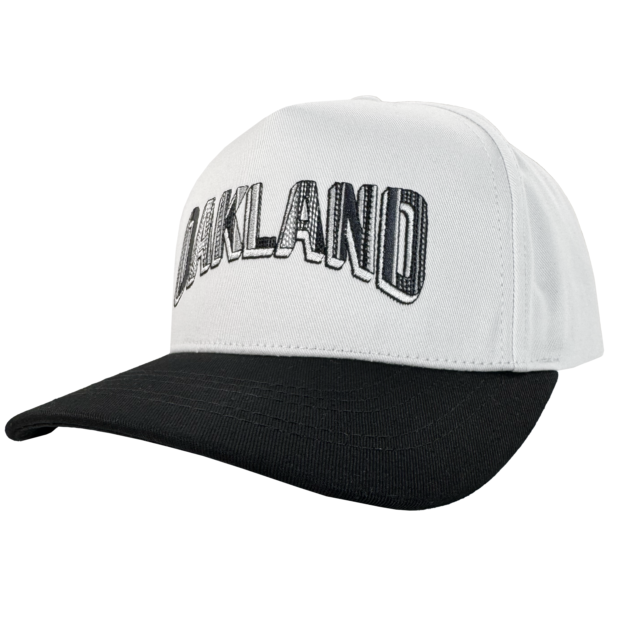 The Oakland Ballers Oakland Beisbol 5 Panel Cap features a white snapback with black brim and bold “OAKLAND” outlined letters—perfect for any baseball fan. The angled view highlights the front and side of this stylish cap.