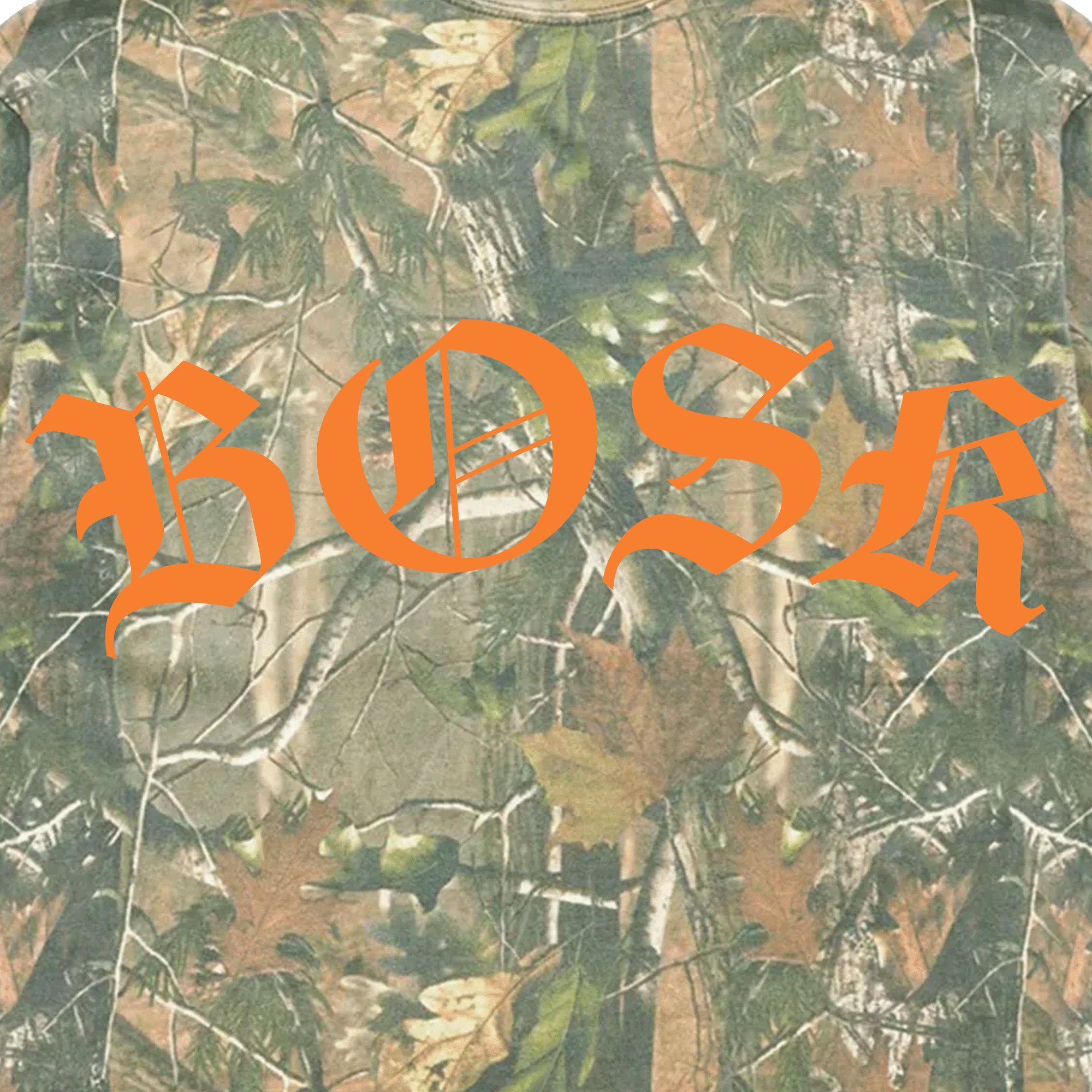 The BOSK Camo Tee by BOSK showcases an oversized fit with a tree camo design featuring green, brown, and tan leaves and branches on heavyweight cotton. The center displays bold orange "BOSK" in gothic script.