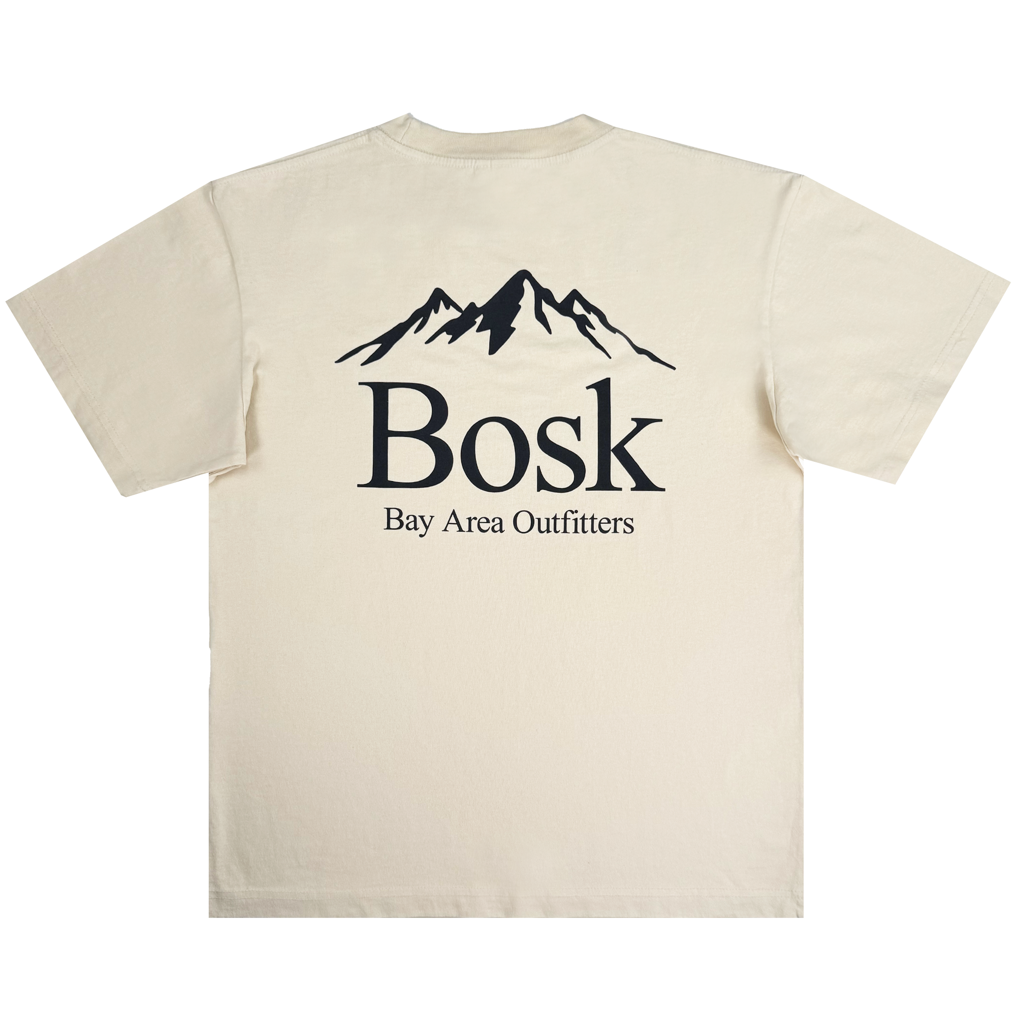 The Bosk Outdoors Tee by BOSK is a beige heavyweight cotton t-shirt with a black mountain graphic on the upper back, "Bosk" in bold below, and "Bay Area Outfitters" in smaller capitals. Designed for men's oversized fit, it's shown against a plain white background.