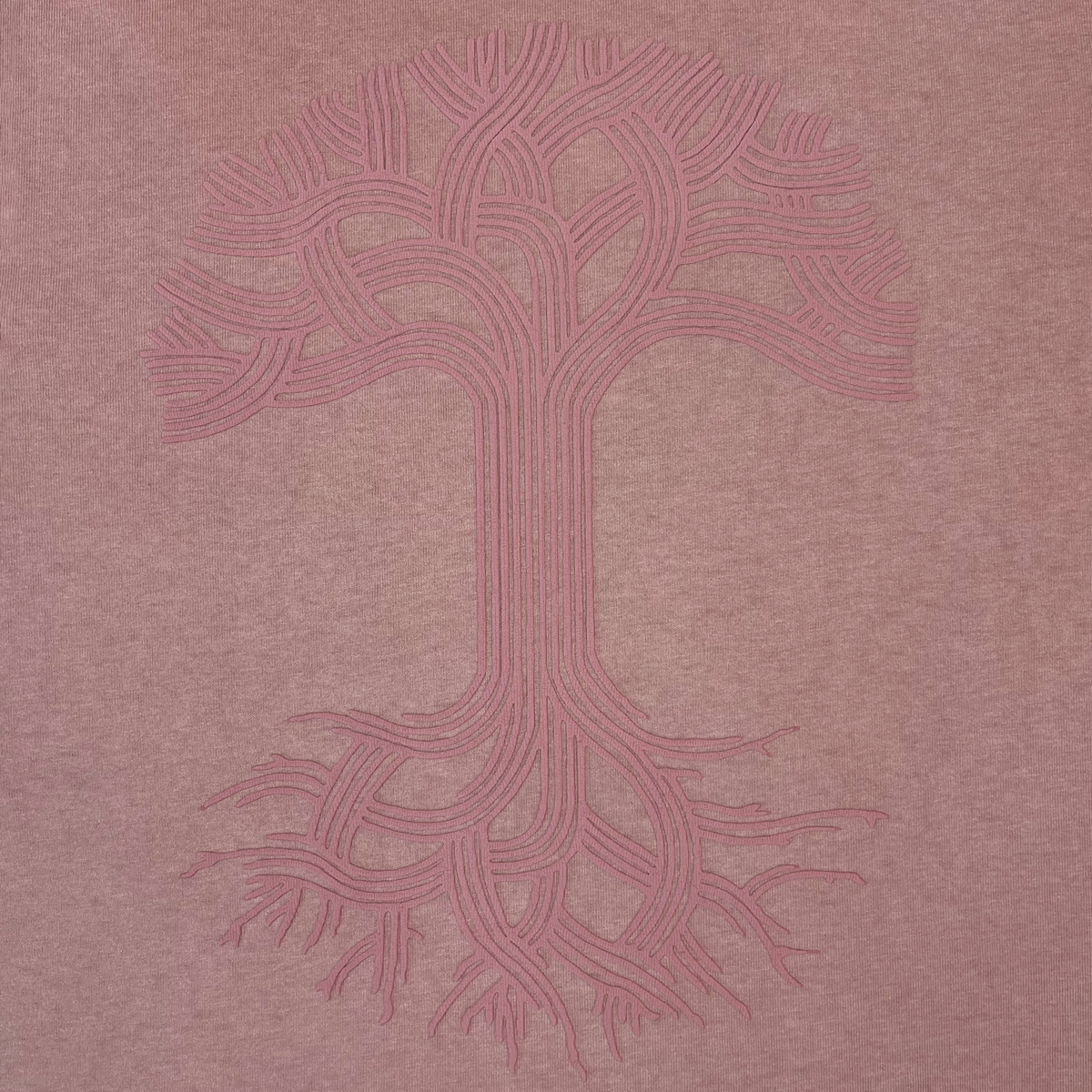 Show off heritage style in the Oaklandish Classic Logo Tee from Oaklandish, featuring their iconic stylized tree design—an abstract, symmetrical tree with an intricate trunk, curved branches, and roots rendered in continuous pink lines on a muted pink background. This men’s classic fit t-shirt is printed on heavyweight cotton for lasting comfort and durability.