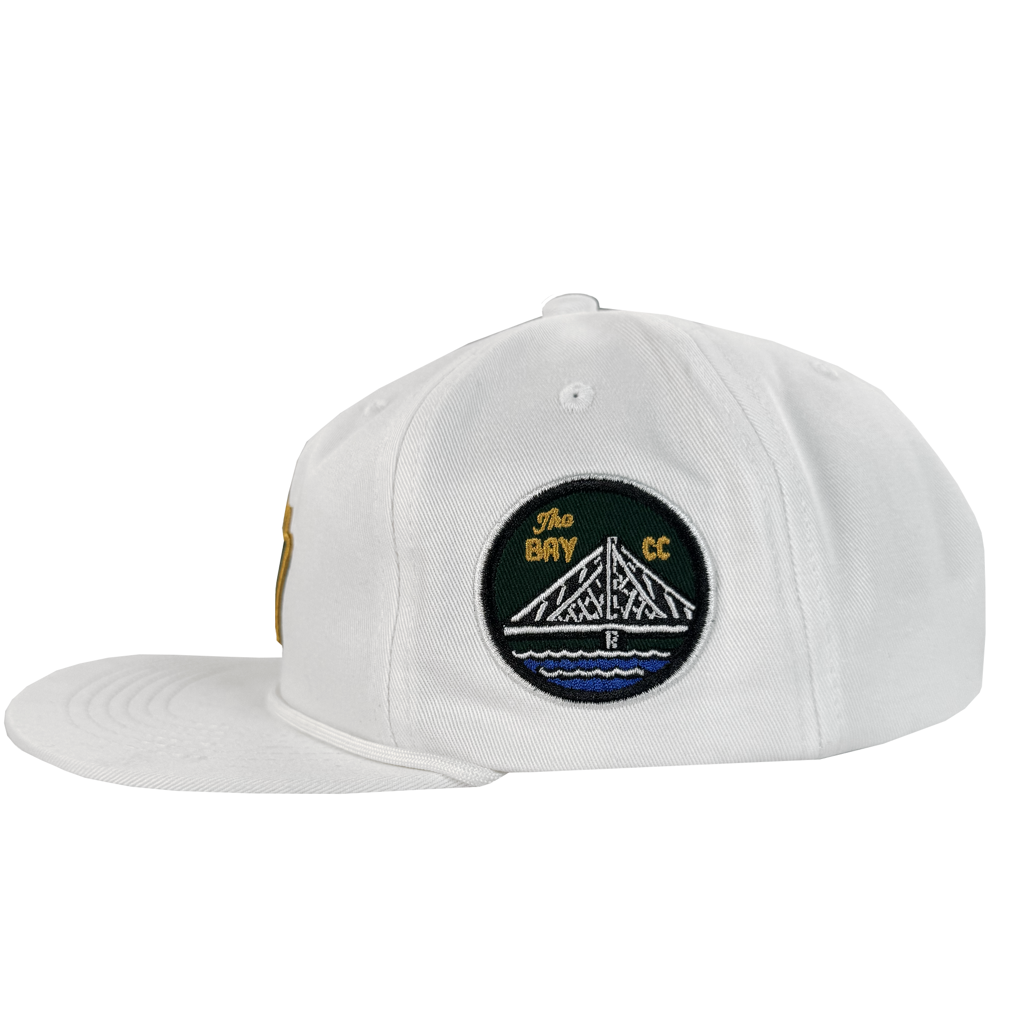 The Bay Area 5 Panel By DOC from Oaklandish is a white, unstructured strap back hat with a left-facing flat brim and a side embroidered patch showing a white bridge over blue water with "The Bay CC." Part of The Bay Collection.
