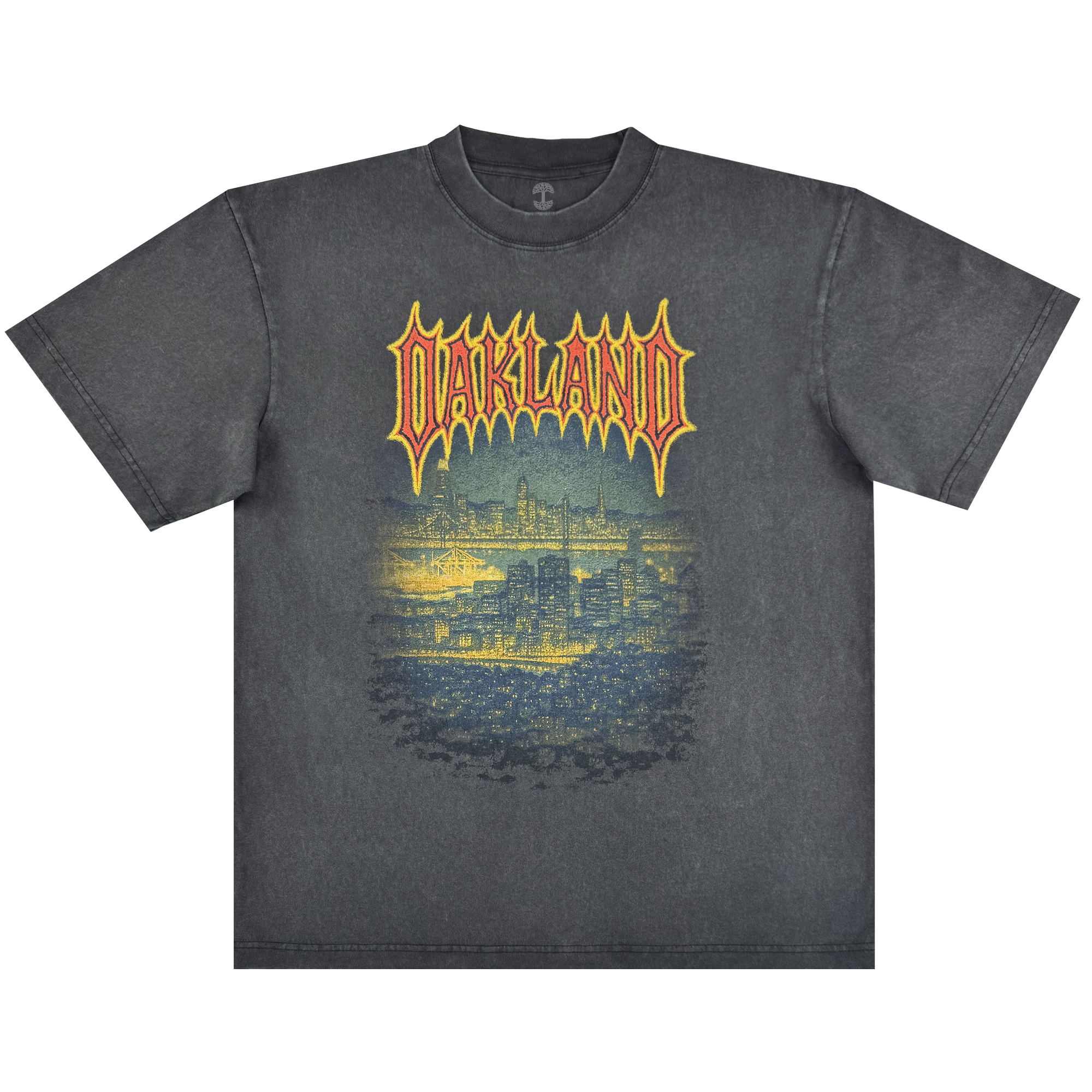 The Oaklandish Ember Tee is a faded black classic fit, 100% cotton shirt featuring "OAKLAND" in bold yellow and red above a detailed blue Oakland skyline graphic on a glowing background for a cool nighttime vibe.