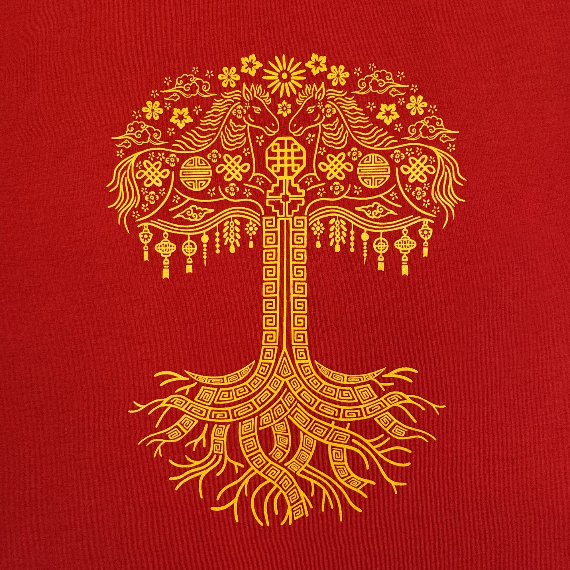 Celebrate the Year of the Fire Horse with Oaklandish's Fire Horse Tee—a 100% cotton classic fit t-shirt featuring a yellow ornate tree, flowers, and lanterns on a red background for a unique cultural look.