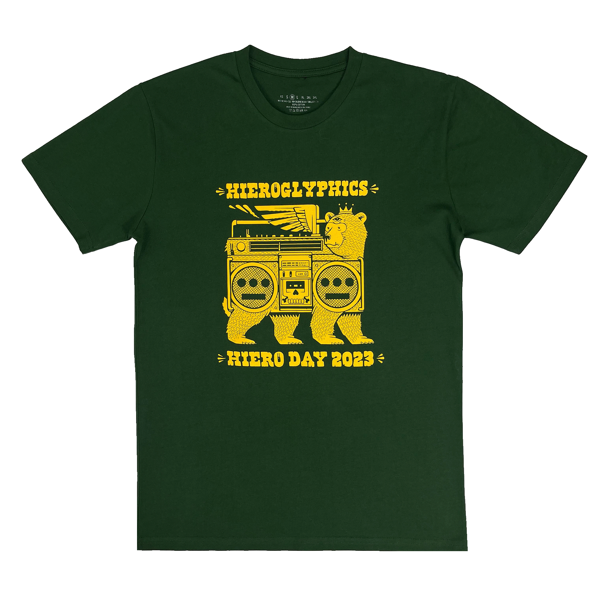 Green t-shirt featuring yellow graphic art with a bear holding a large stereo with wings as the central design. The text "Hieroglyphics" is above and "Hiero Day 2023," marking this limited-edition shirt for the annual hip-hop music festival by Hieroglyphics Crew, is below. Additional icons decorate the ends of the text. A shirt tag appears at the inside back collar.