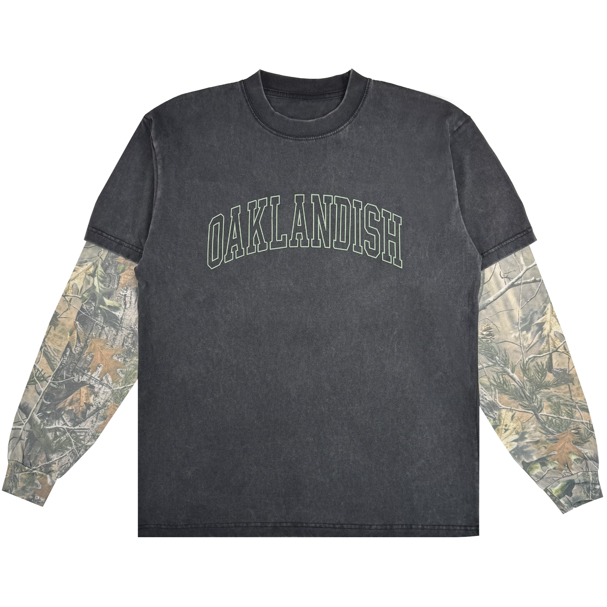 The Oaklandish Hunter LS Tee is a black washed crewneck with bold, arched green "OAKLANDISH" text and camo sleeves under short sleeves. Made from 100% cotton, this standout shirt is shown against a white background.