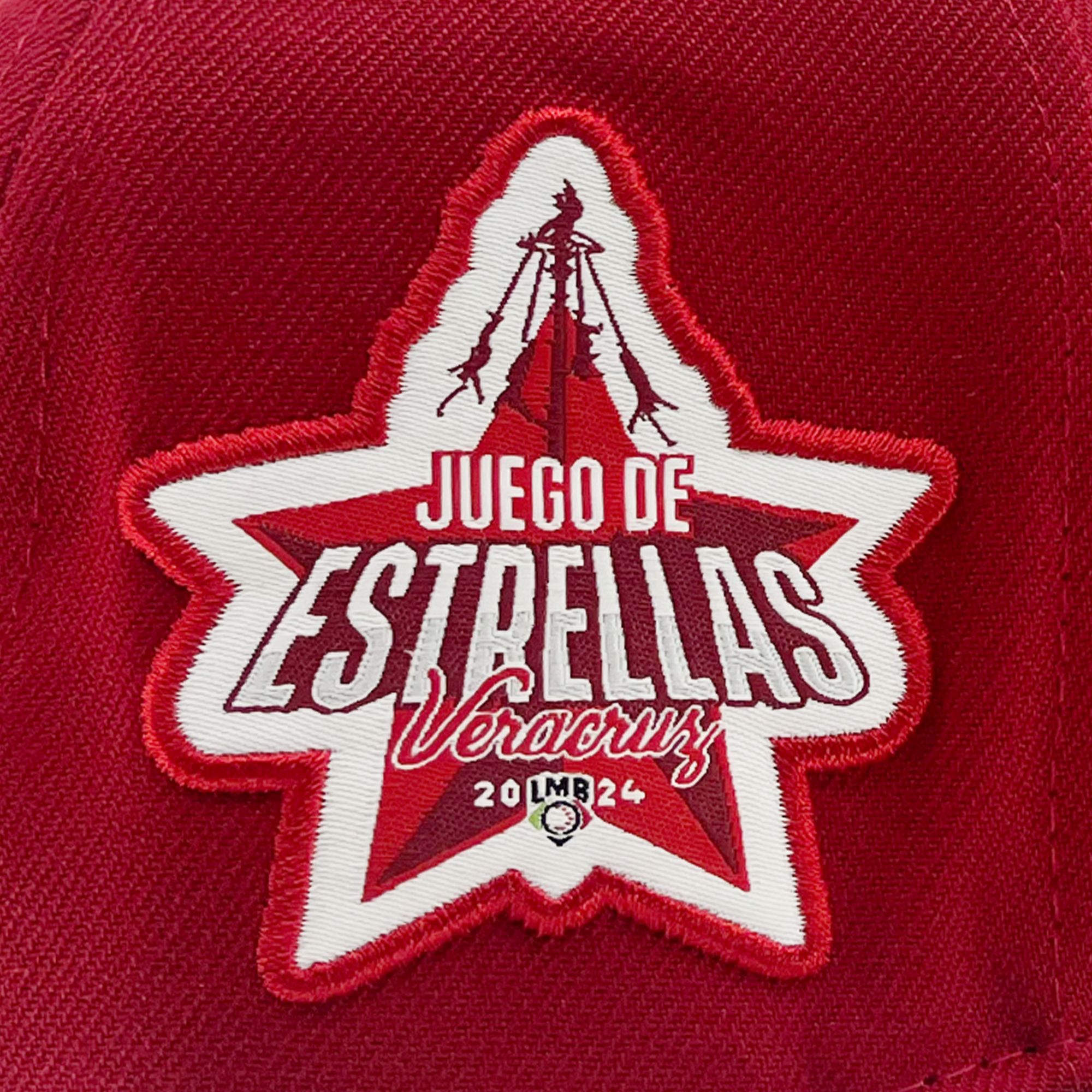 Detailed right side view of red New Era 59fifty fitted hat with El Aguila logo and Juego de Estrellas Veracruz LMB patch.