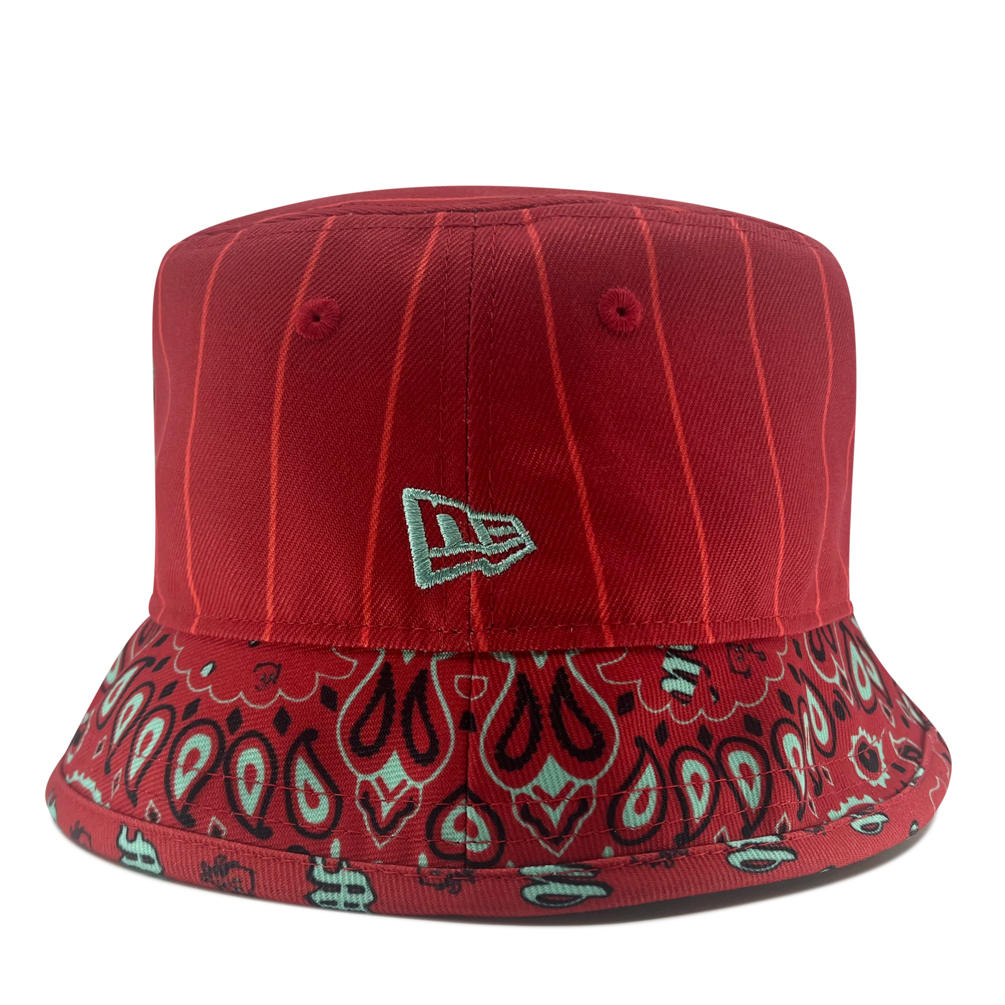 Introducing the New Era Diablos Paisley Bucket by Retail Vendors: a red polyester hat featuring white pinstripes on the crown and a bandana-inspired pattern around the brim. The design includes paisley and abstract floral elements in shades of white and black, complemented by a small, white embroidered logo on the front.