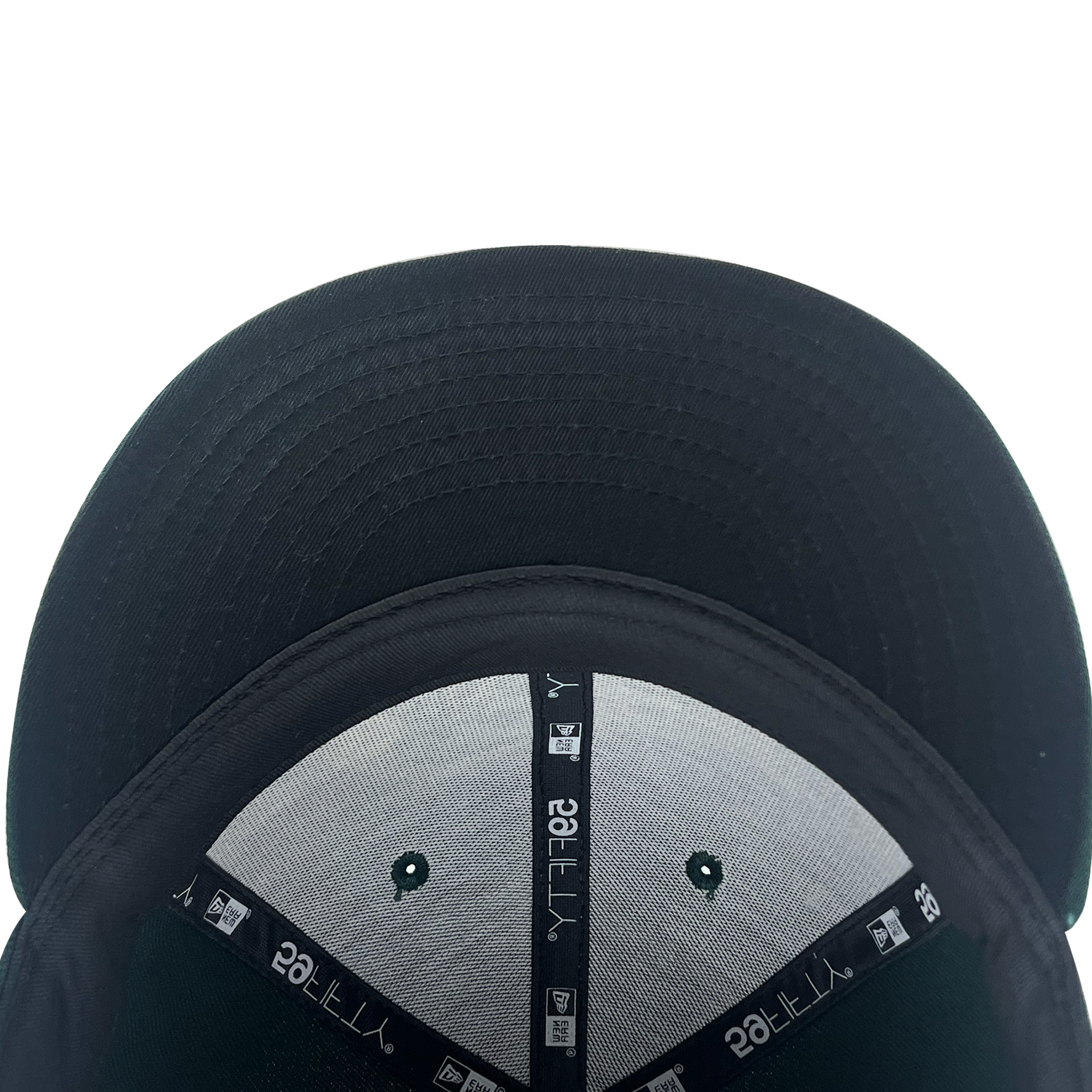 Inside and bill view of forest green 59fifty fitted hat with Pericos logo.