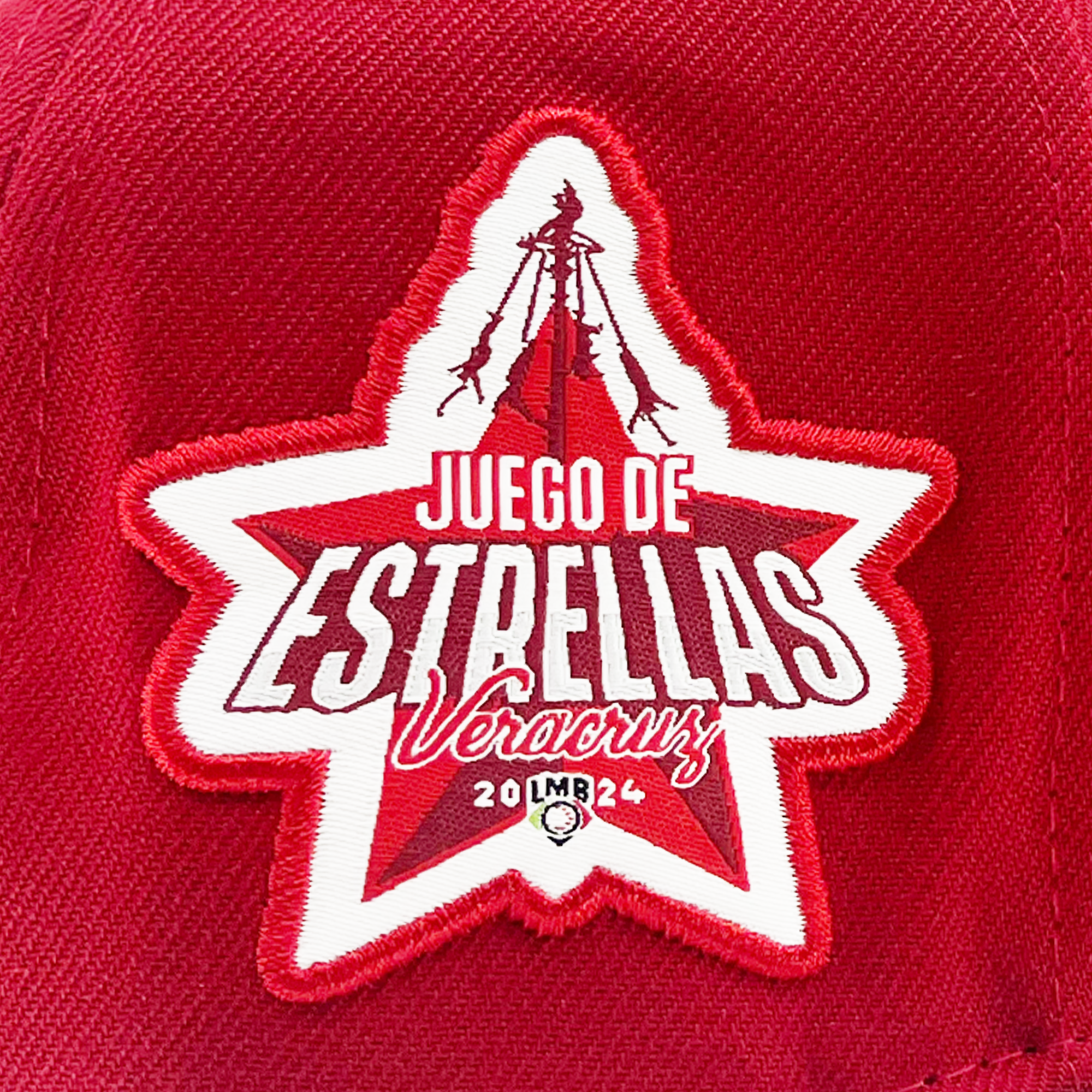 Detailed view of red New Era 59fifty fitted hat with El Aguila logo and Juego de Estrellas Veracruz LMB patch.