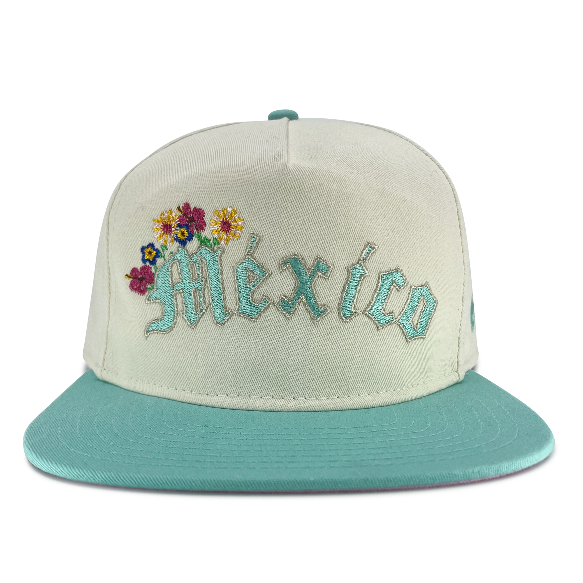 Front view of cream New Era golfer hat with embroidered Mexico and floral design.