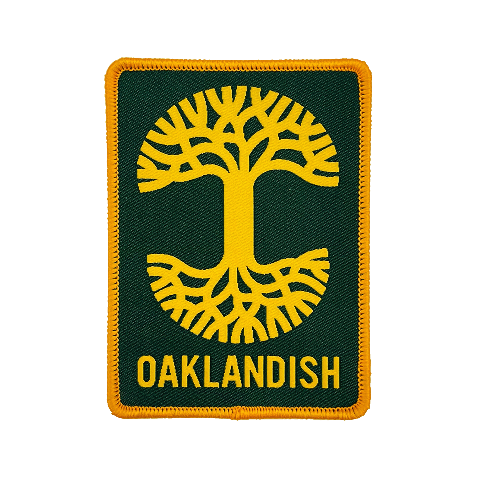 The Oaklandish Rectangle Patch by Oaklandish is a rectangular patch featuring a dark green background with yellow stitching around the edges. The embroidered iron-on patch showcases a stylized yellow tree with symmetrical roots and branches extending from a central trunk. Below the tree, "OAKLANDISH" is written in yellow capital letters, representing Oakland.