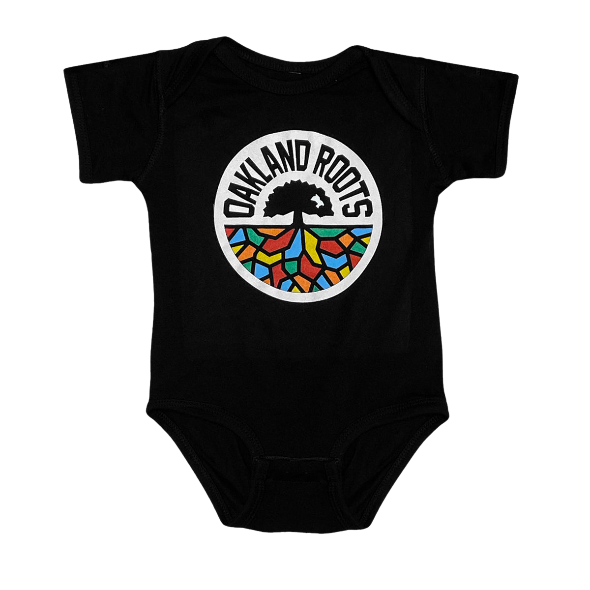 A black Infant Oakland Roots SC Logo One-Piece from Oakland Roots SC, showcasing the club's emblem. This emblem has a white circular background with "OAKLAND ROOTS" in bold, black, capitalized text curved at the top. Inside the circle is a striking black tree, its roots intricately colored in blue, red, yellow, green, and orange—celebrating this vibrant sports club.