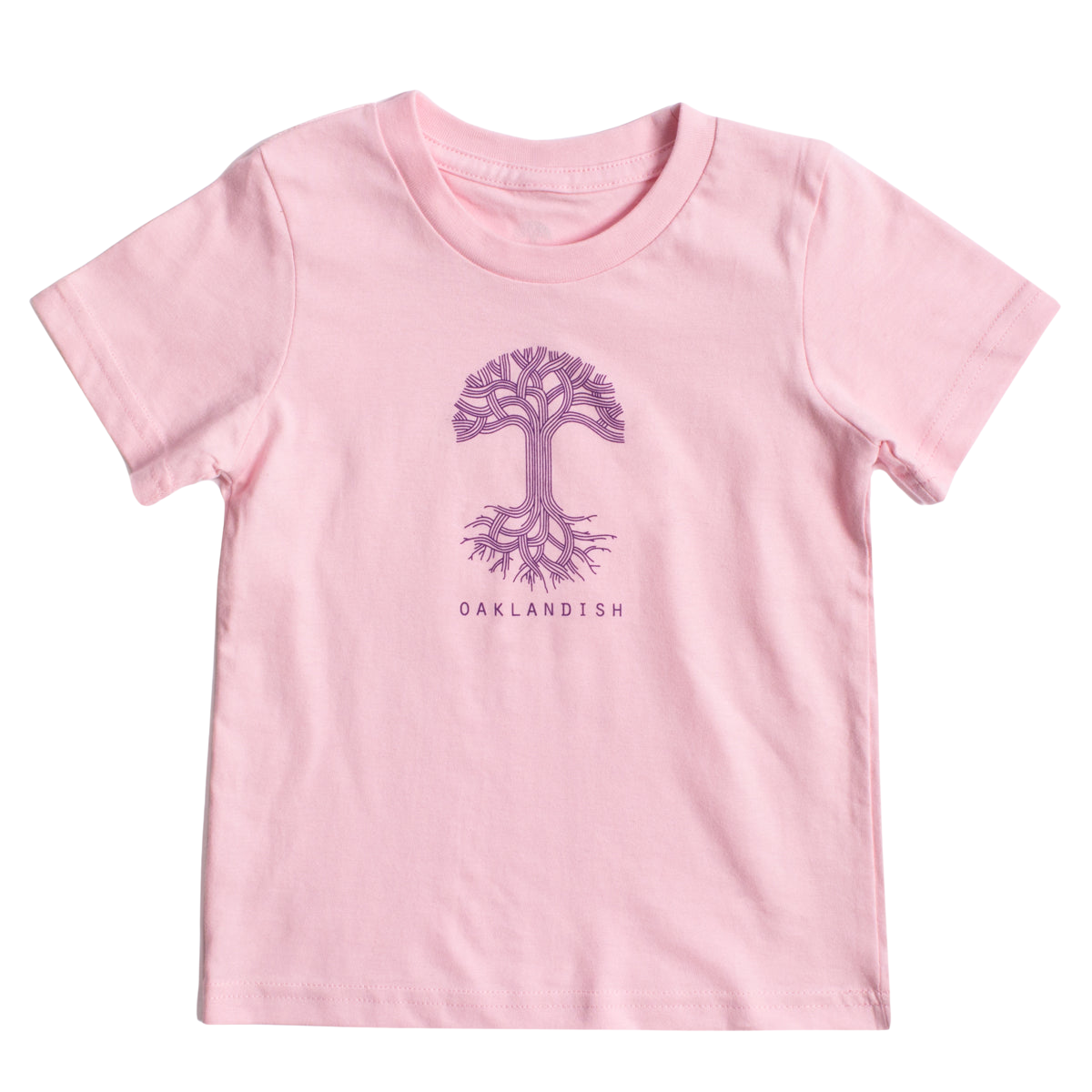 A light pink, 100% cotton Toddler Oaklandish Classic Logo Tee from Oaklandish featuring a purple tree graphic with intricate branches and roots in the center. Below the tree, "OAKLANDISH" is printed in a simple, all-caps font. The t-shirt is laid flat against a white background.
