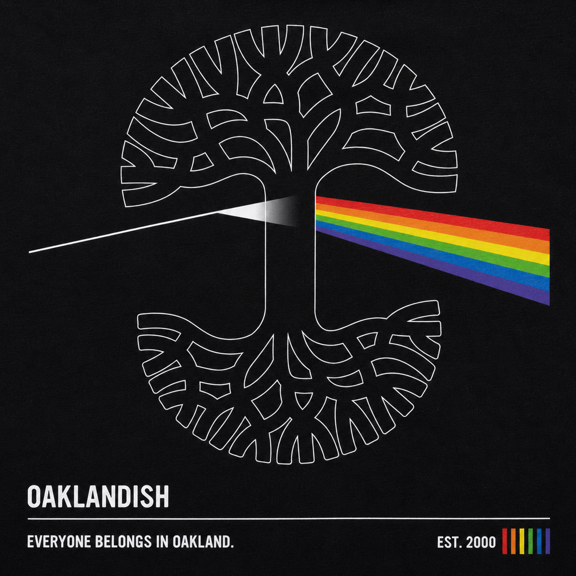 The Prismatic Tee by Oaklandish features a white tree logo with roots, a rainbow beam inspired by Pink Floyd, and “OAKLANDISH. Everyone belongs in Oakland.” Printed on a 100% cotton classic fit men's black t-shirt.
