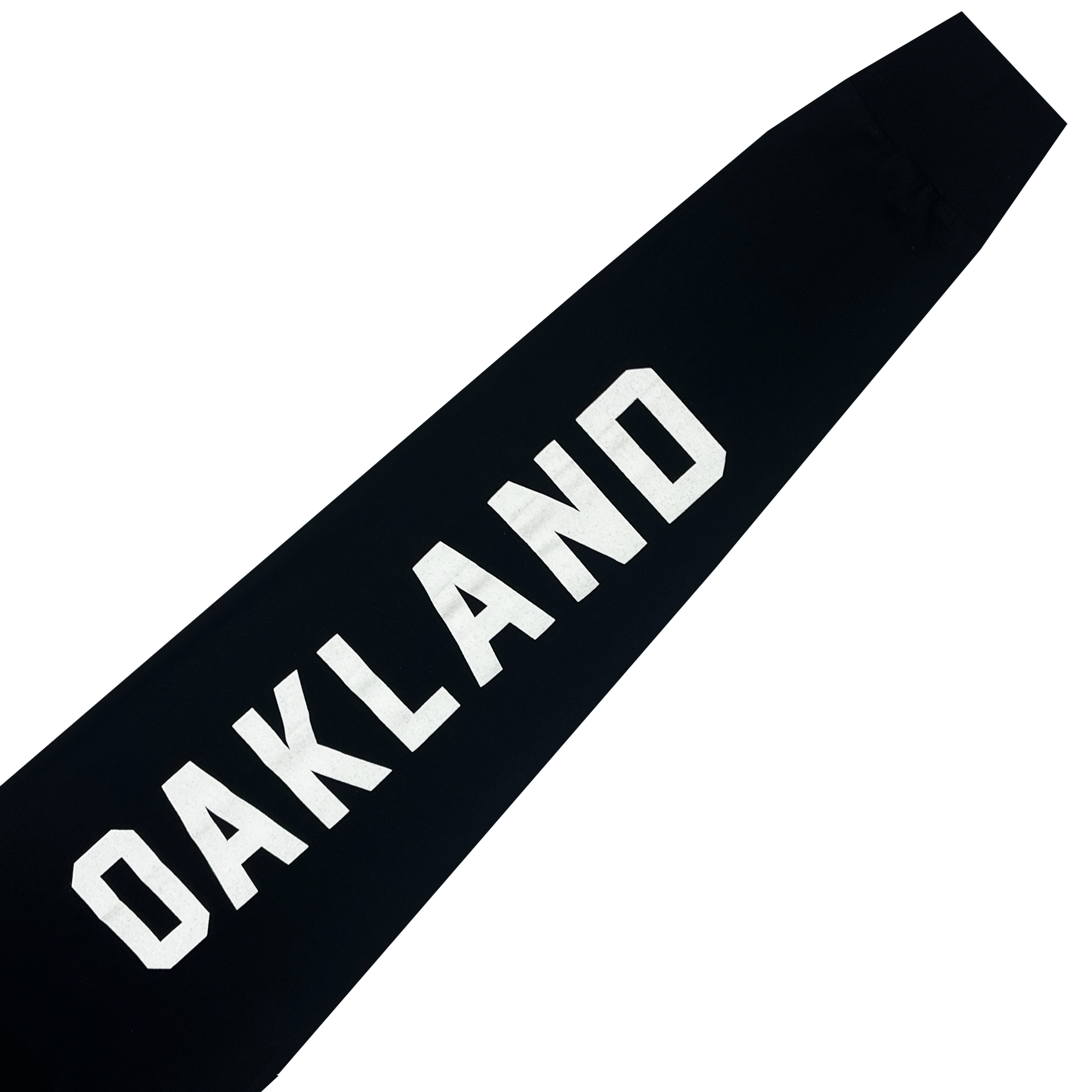 The Oakland Roots SC Classic 2.0 LS Tee is a black long-sleeve t-shirt featuring the word "OAKLAND" in large, bold, white letters diagonally positioned across the front from the bottom left to the top right. Set against a dark background, this soft, cotton-like garment is ideal for fans of the Oakland Roots sports club.