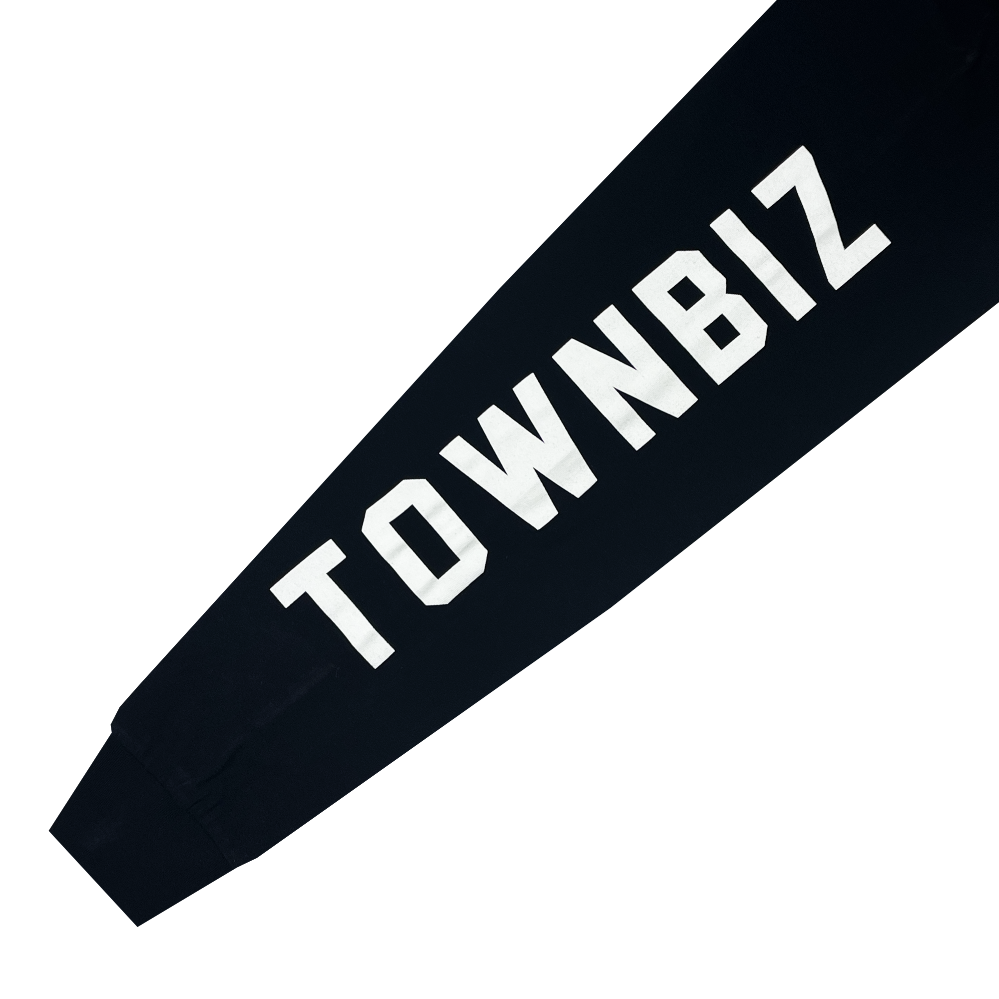 Close-up of a black sleeve featuring bold, white, uppercase text that reads "TOWNBIZ." The sleeve appears to be part of the Oakland Roots SC Classic 2.0 LS Tee by Oakland Roots SC, and the text runs along the length of the sleeve. The background is plain white.