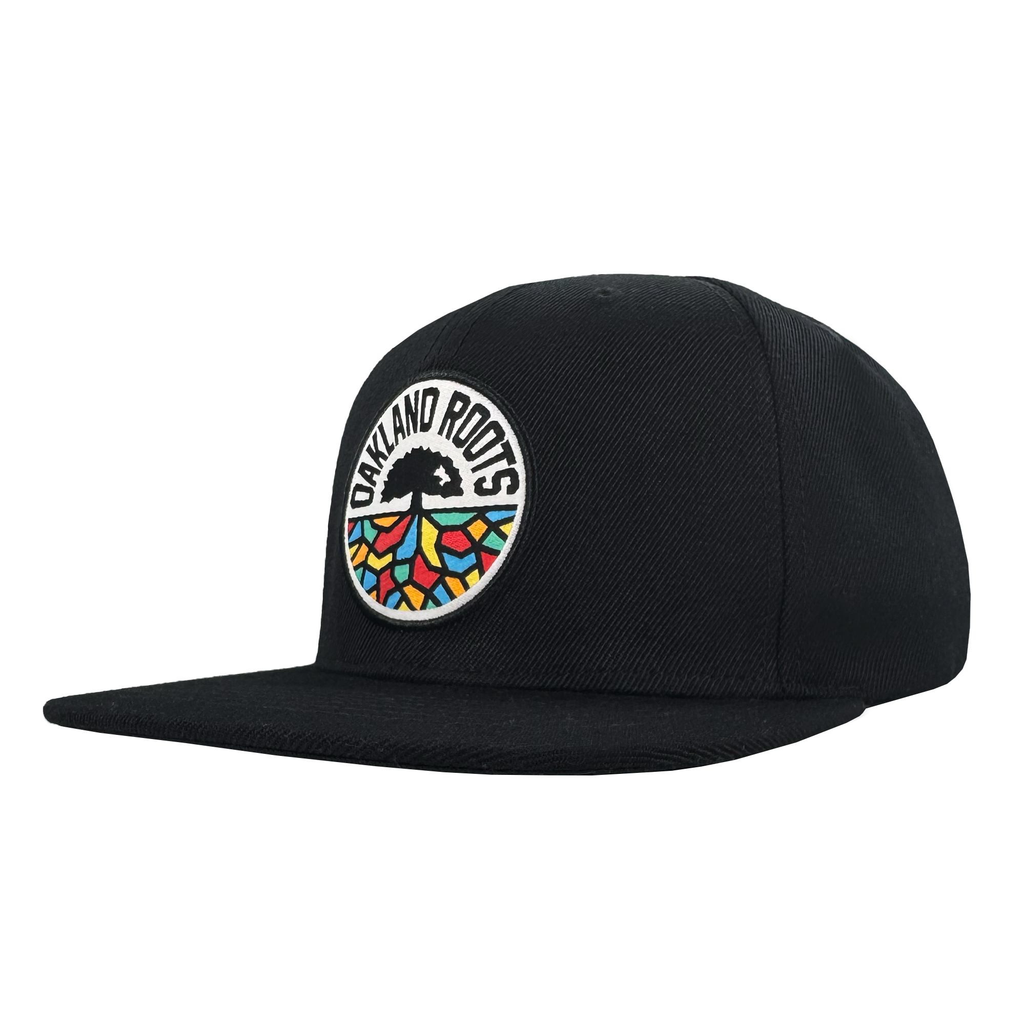 The Oakland Roots SC Structured Snapback is a black flat-brim cap with a round front patch showing "OAKLAND ROOTS," a black tree, and colorful root patterns—ideal for any passionate Oakland Roots SC supporter.