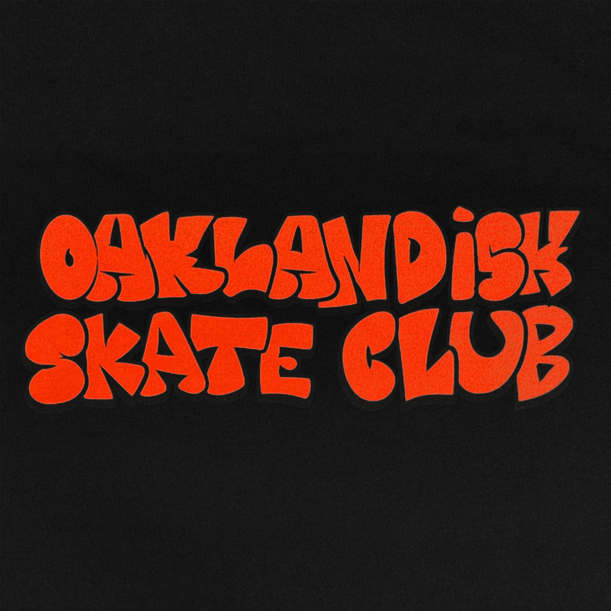 Bold, bright orange bubble letters spell "OAKLANDISH SKATE CLUB" on black. This Oaklandish Skate Club Tee captures skateboard culture with its playful retro font—perfect for a classic fit inspired by groups like Crenshaw Skate Club.