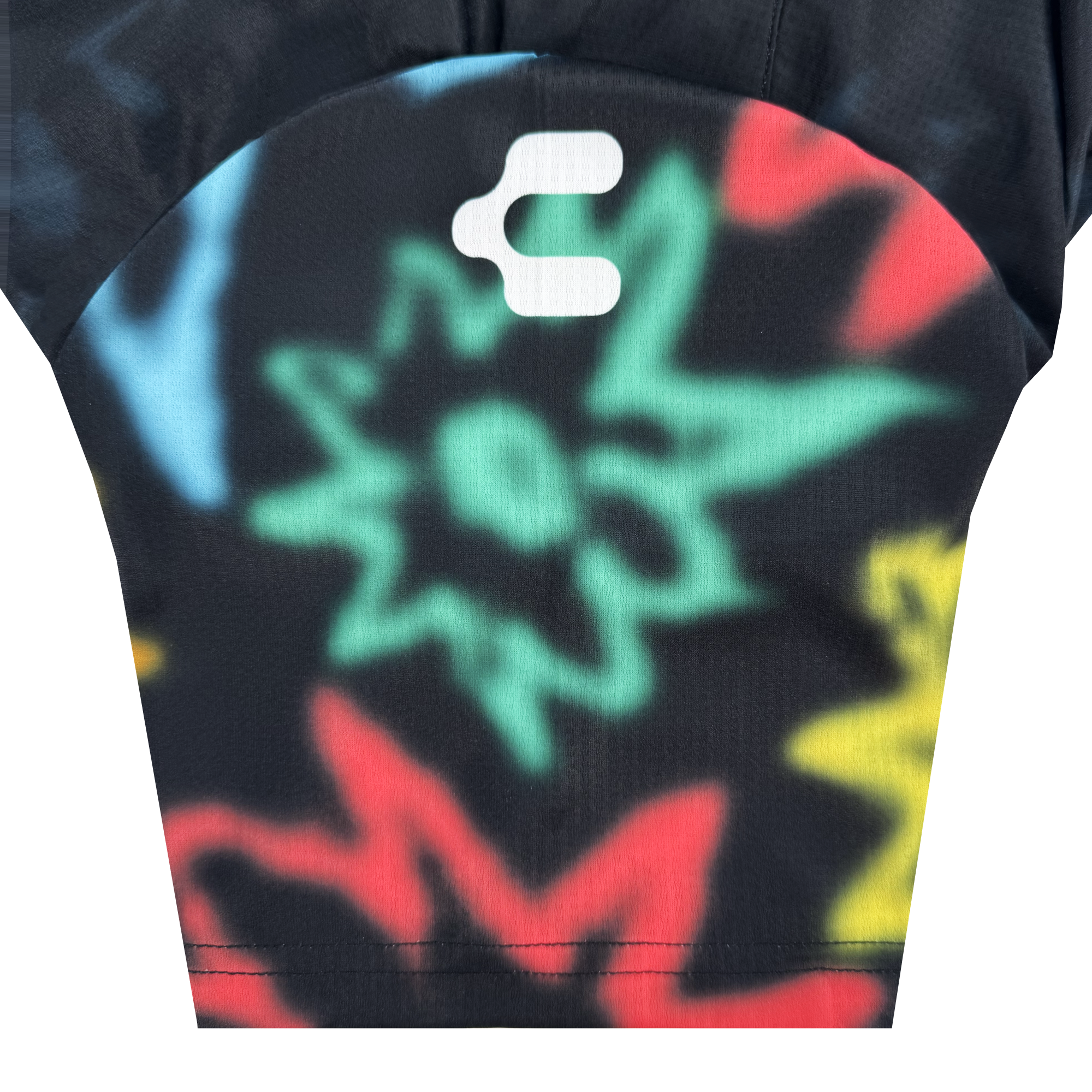 The Unisex Soul Bloom Kit by Oakland Soul features a black fabric with colorful, graffiti-inspired starbursts in green, red, yellow, and blue, soft blurred edges, and a white abstract Charly “C” logo at the top center.