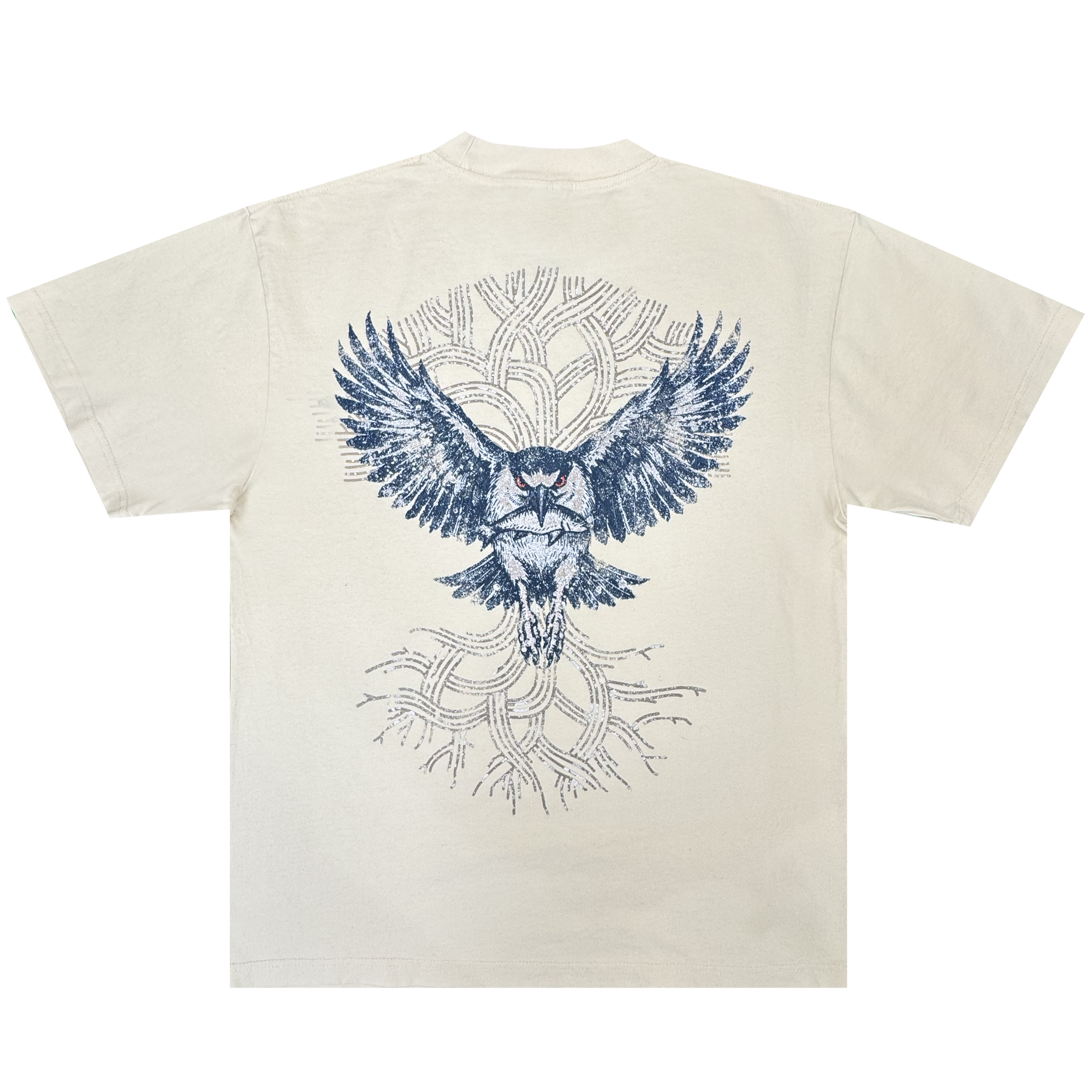 The Oaklandish Swoop Tee is a cream-colored, heavyweight cotton men’s t-shirt featuring a bold blue owl graphic with outstretched wings on the back. Abstract, tree-like branches form a circular pattern behind the owl, adding depth to the layered design on this classic fit tee.
