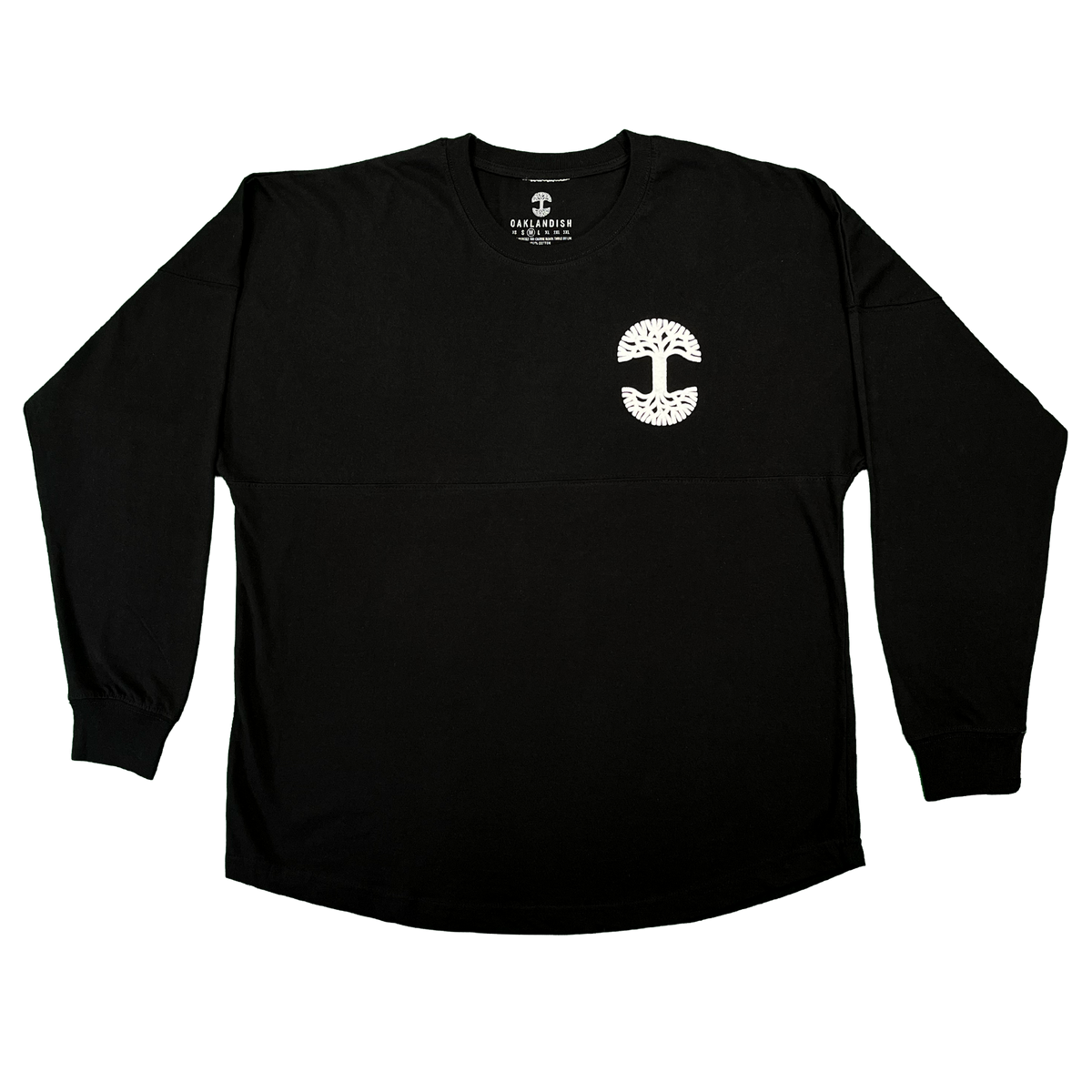 The Temple LS Tee by Oaklandish is a men’s heavy-weight, long sleeve black t-shirt made from 100% cotton, featuring a crewneck design. A small white graphic—depicting a tree with roots and branches forming a circular shape—adorns the left chest. The shirt is displayed laid flat on a plain white background.