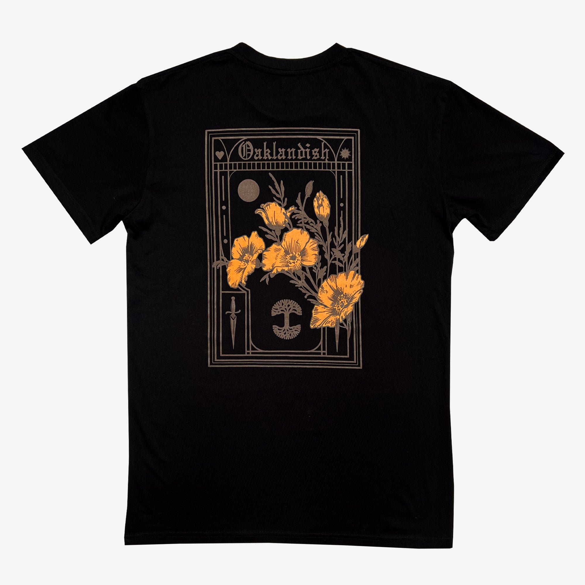 The "Blossom Tee" by Oaklandish is a black men's cotton t-shirt with a decorative design on the back, showcasing several yellow poppies—the California state flower—in front of a rectangular frame with art deco elements. The top of the frame reads "Oaklandish," and the bottom features stylized images of a sword and an ouroboros.
