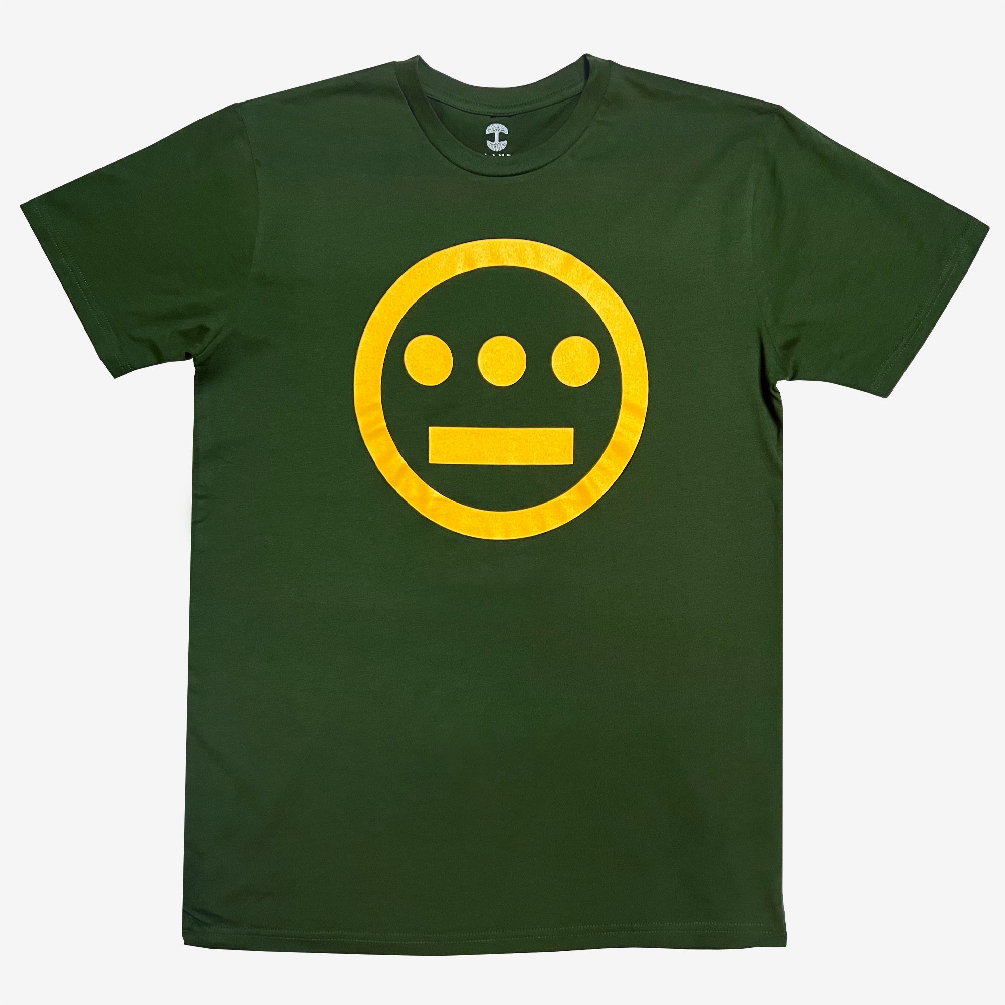 The Hieroglyphics brand's Hiero Classic Logo Tee is a dark green, classic fit T-shirt that features a large, bright yellow logo on the front. The logo consists of a circular shape with a horizontal line and three dots above it, resembling minimalist hieroglyphics of a face. The T-shirt is displayed against a plain white background.