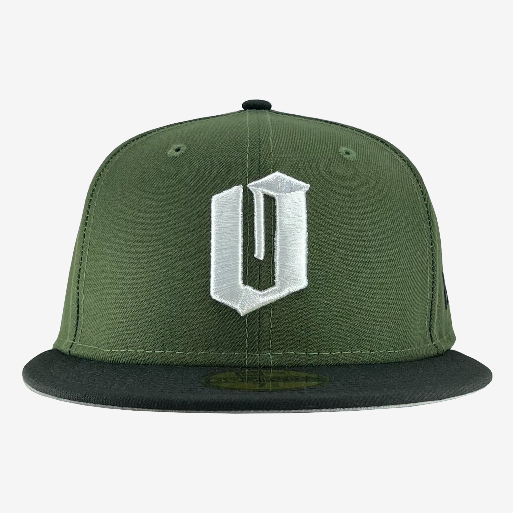 A front view of the New Era Official 59FIFTY Fitted Cap by Oaklandish showcases an olive green baseball cap with a black bill and flat brim, embodying the iconic New Era look. The fitted cap features a large, stylized white "U" logo embroidered on the front panel. The button at the top is also olive green, highlighting its structured design.
