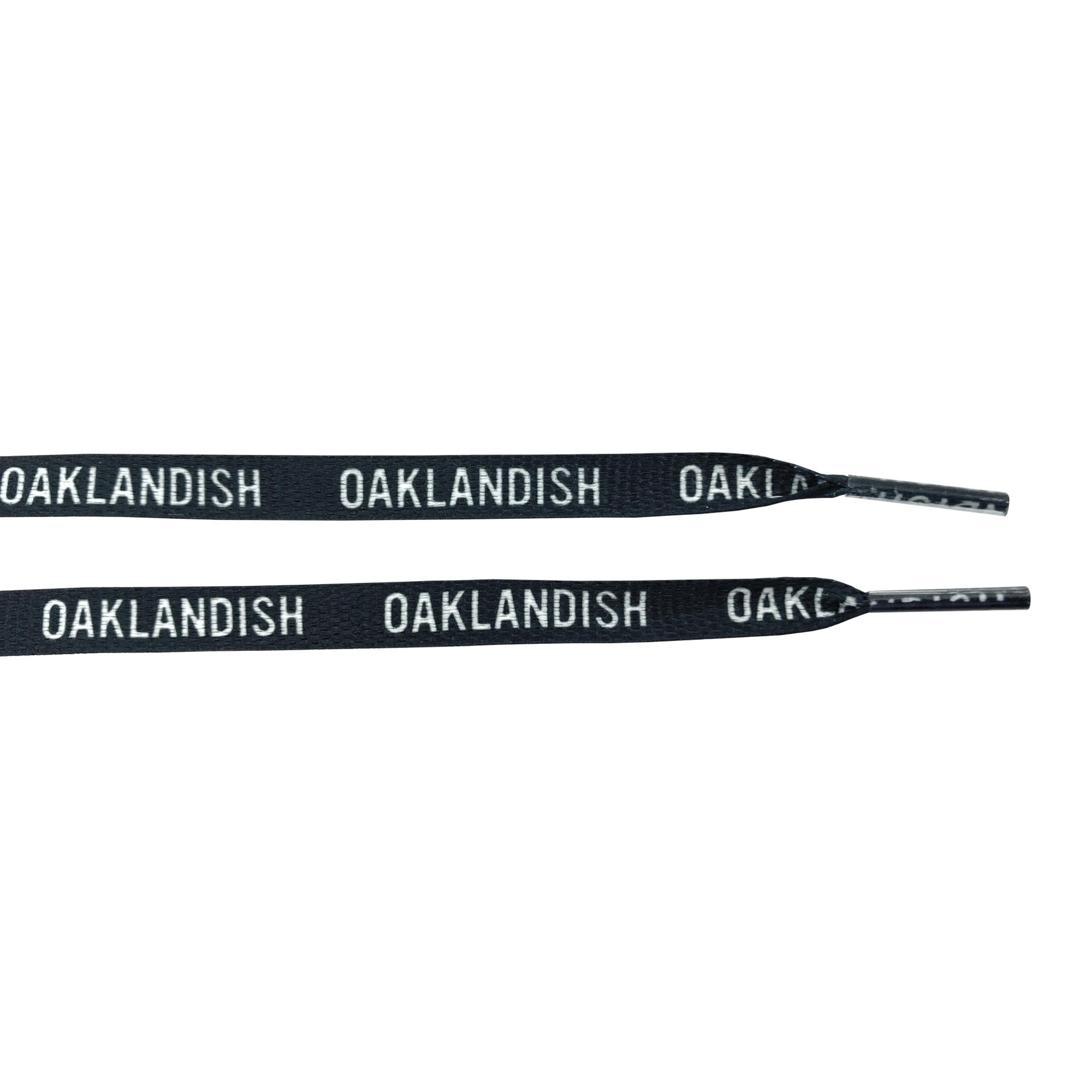 The "Wordmark Shoelaces" from Oaklandish are crafted from 100% black polyester and feature the word "OAKLANDISH" repeatedly printed in white, uppercase letters along their length. Resembling flat shoelaces, they are partially coiled to highlight the striking contrast between the black material and the white text, set against a plain white background.