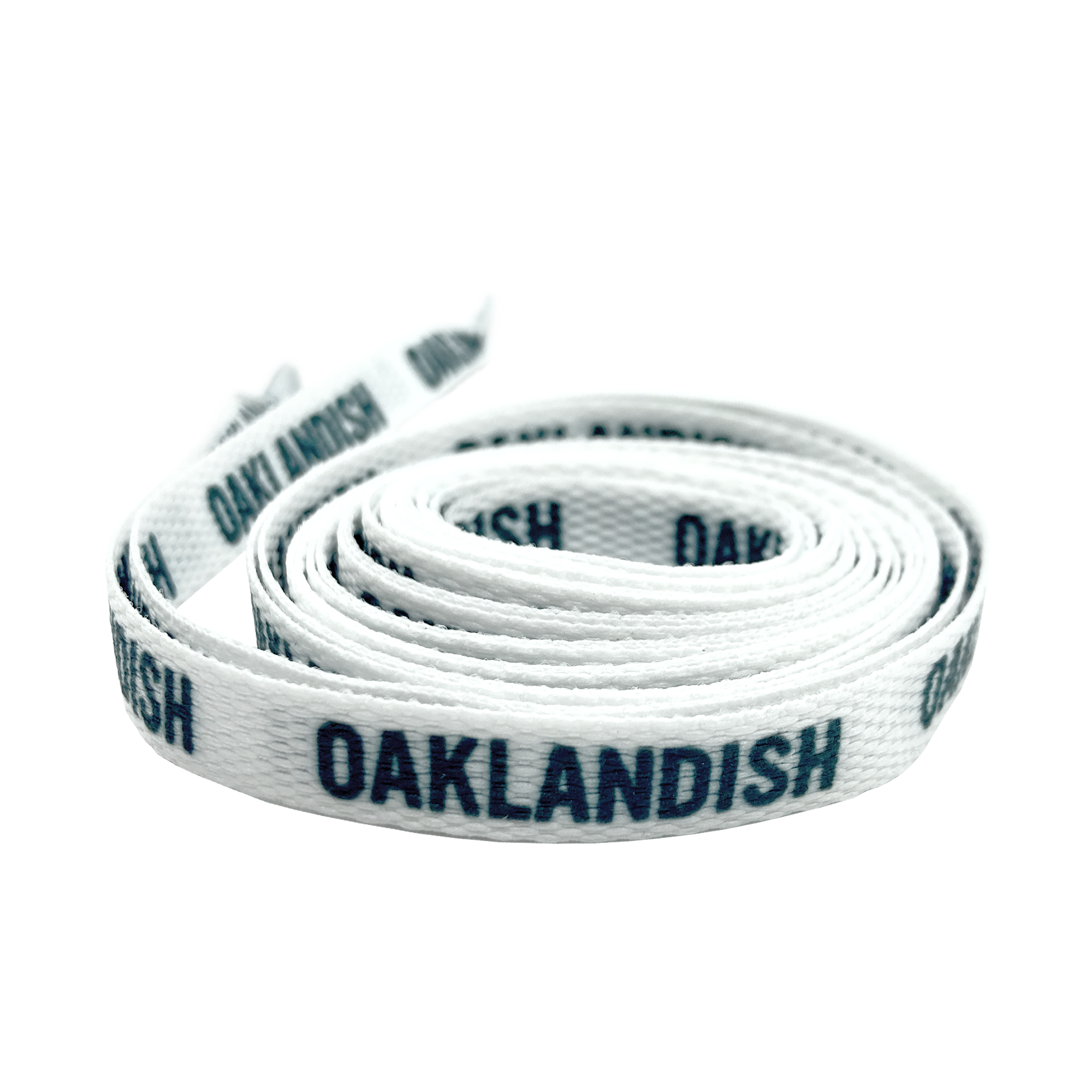 The Wordmark Shoelaces by Oaklandish are coiled white polyester laces with the word "OAKLANDISH" printed in black, repeated along their length. The flat shoelace is neatly wound and lies flat with one end slightly elevated, showing a visible tip.