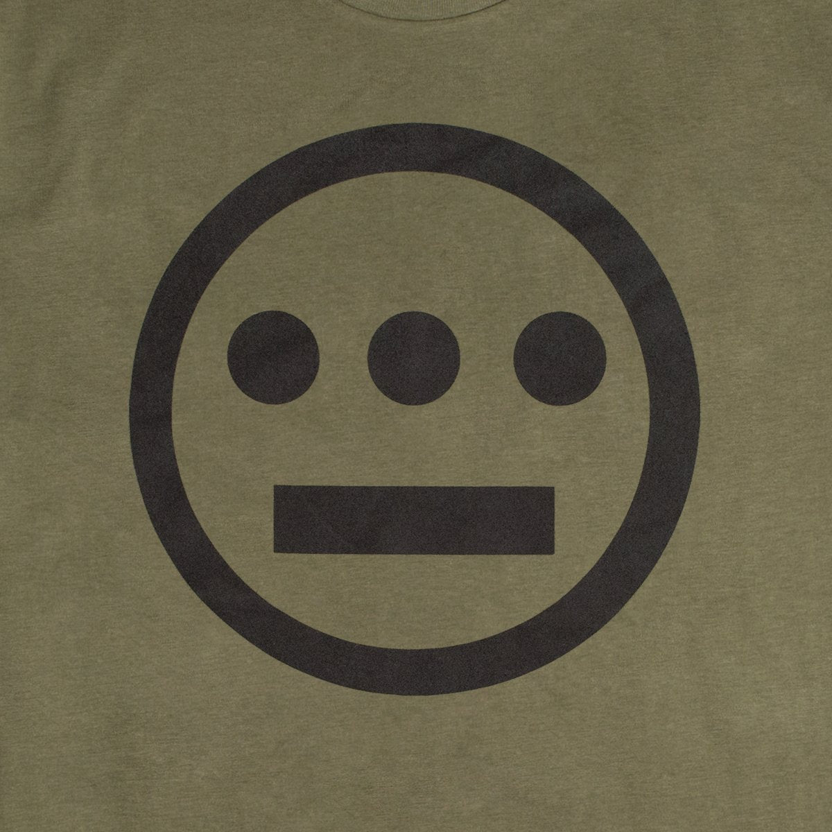 Close up of white Hieroglyphics Hip-Hop logo on an army green t-shirt.