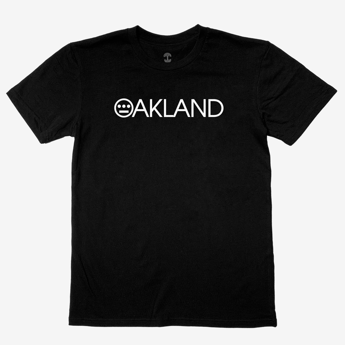 The Hieroakland Tee by Hieroglyphics is a black, 100% cotton T-shirt featuring the word "OAKLAND" in white capital letters across the chest. The "O" is uniquely stylized with a smiley face made of three horizontal lines within the circle. With its classic fit, simple crew neck, and short sleeves, this shirt is perfect for promoting Town business. It's displayed against a plain white background.
