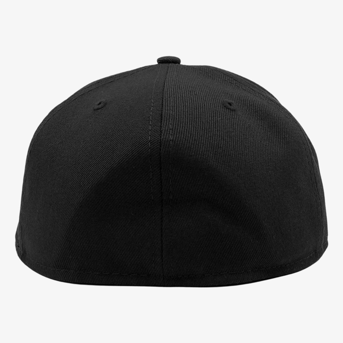 The image displays the back view of a black New Era Official 59FIFTY Fitted Cap from Oaklandish. The cap features a smooth and seamless design with two small ventilation holes on each side. The fabric appears to be a durable material, likely cotton or a blend suitable for casual wear. This headwear has no visible logos or branding.