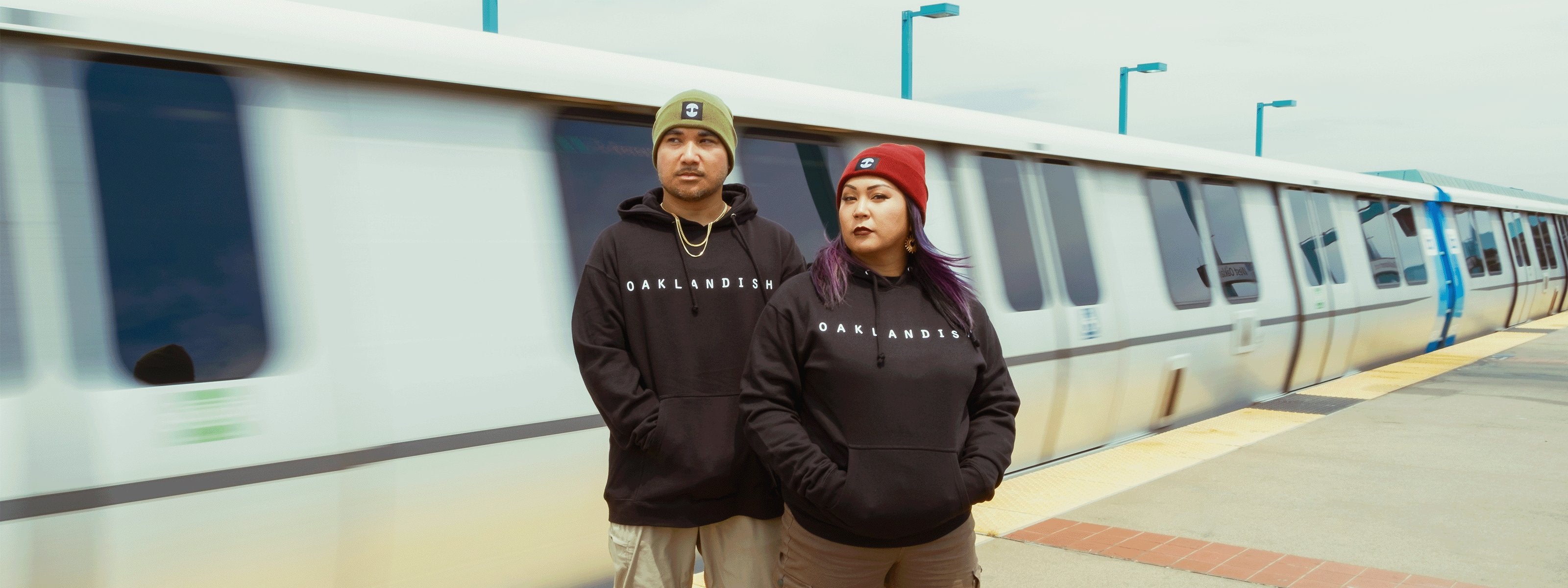 A collection of beanies with the Oaklandish and Hieroglyphics logo.