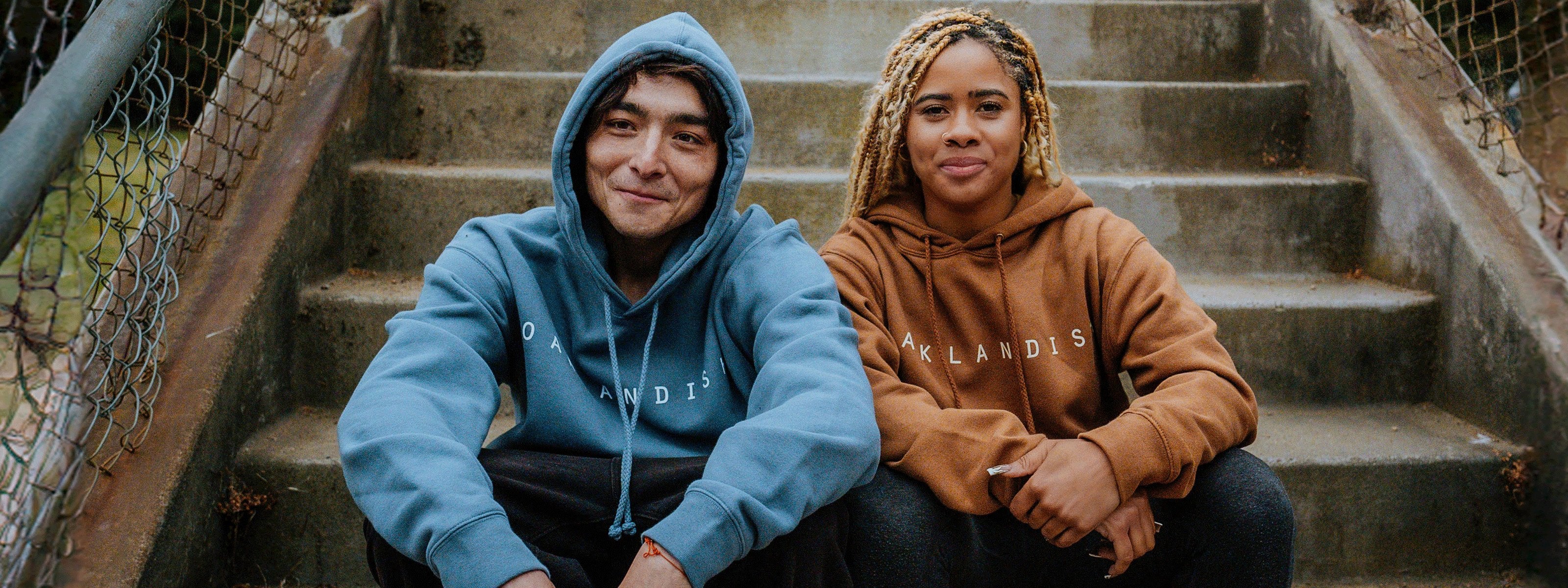 Models wearing Oaklandish classic hoodies.