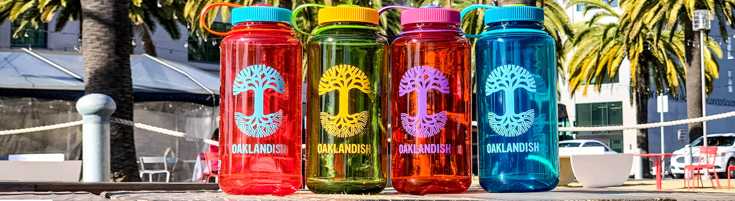 A collection of 4 Nalgene bottles in an outdoor setting.