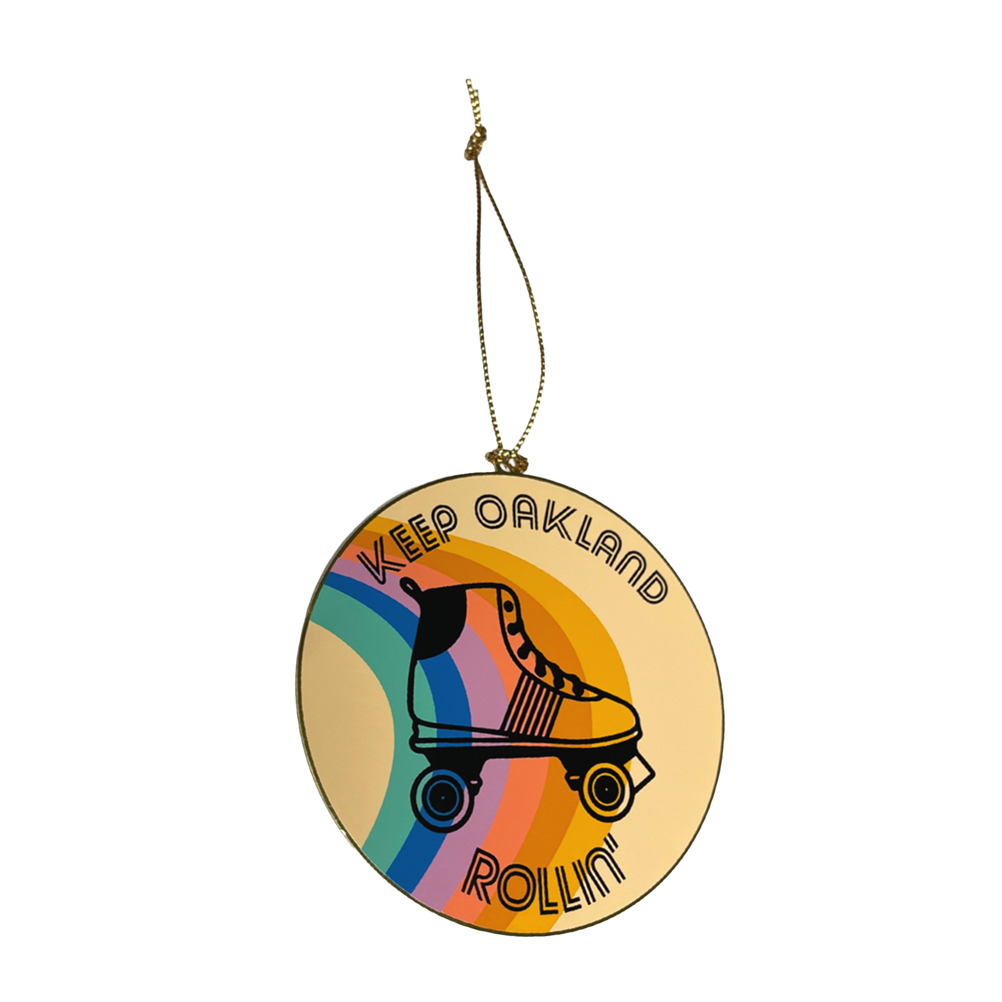 The Keep Oakland Rollin' Brass Ornament by Oaklandish is ideal for holiday decorating, showcasing a vintage roller skate with "Keep Oakland Rollin'" elegantly curved around it. The background is decorated with bold stripes of yellow, orange, blue, and pink and comes with a gold string for simple hanging.