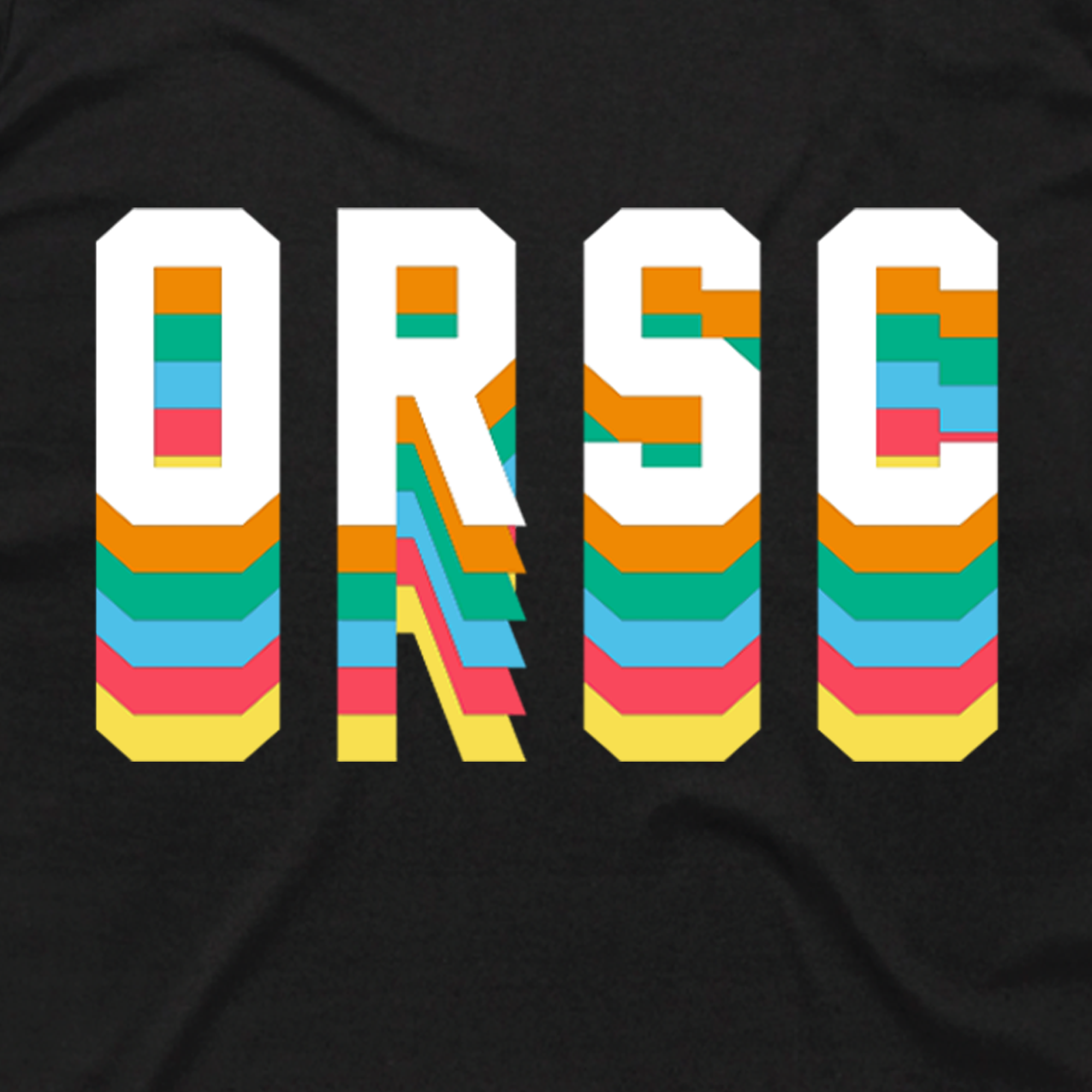 The image showcases the letters "ORSC" in a bold, block font set against a black background. Each letter is filled with vibrant colors such as orange, turquoise, pink, yellow, and white. This visually striking design captures the energetic spirit of an Oakland Roots SC sports club tee.