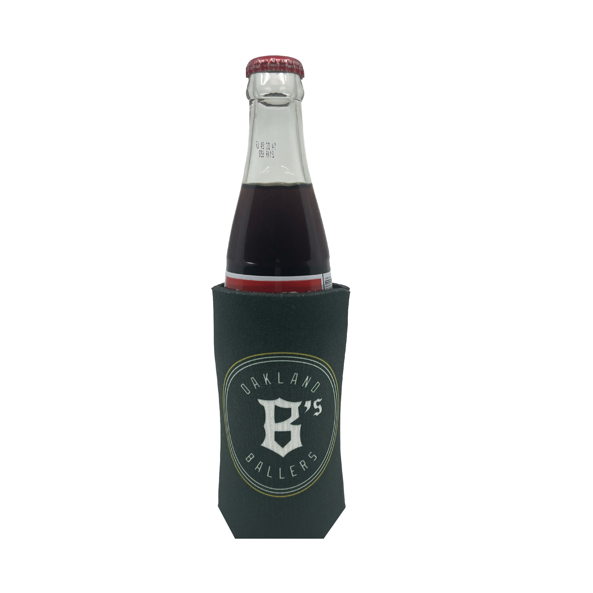 A beverage bottle with a dark-colored drink is placed inside the Oakland Ballers 16oz Can Cooler, which is green and features the bold logo and text: "OAKLAND 95 BALLERS," representing the professional baseball team from the Pioneer League, with a prominent 'B' and '95' at its center. The beverage looks dark red or brown.