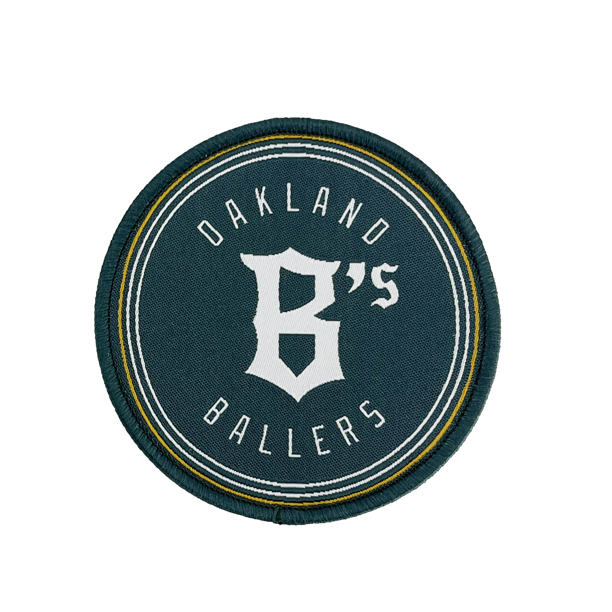 The Oakland Ballers Logo Patch from the Oakland Ballers features a circular design with a dark green background. The words "Oakland Ballers" are arched along the top and bottom edges, while a large, stylized white "B's" occupies the center. Representing the professional baseball team in the Pioneer League, this patch is bordered by thin white and yellow rings.