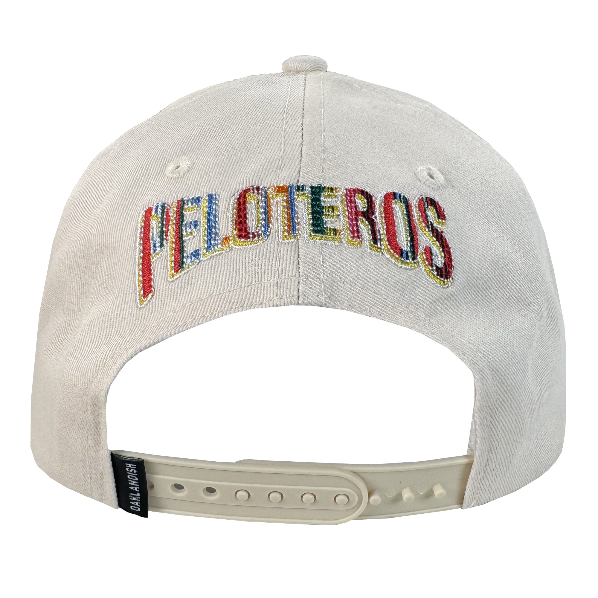 The Oakland Beisbol 5 Panel Cap by Oakland Ballers is a white snapback shown from the back with "PELOTEROS" in multicolored thread, an adjustable white plastic strap, and a black "CAP SLAM USA" tag on the side.