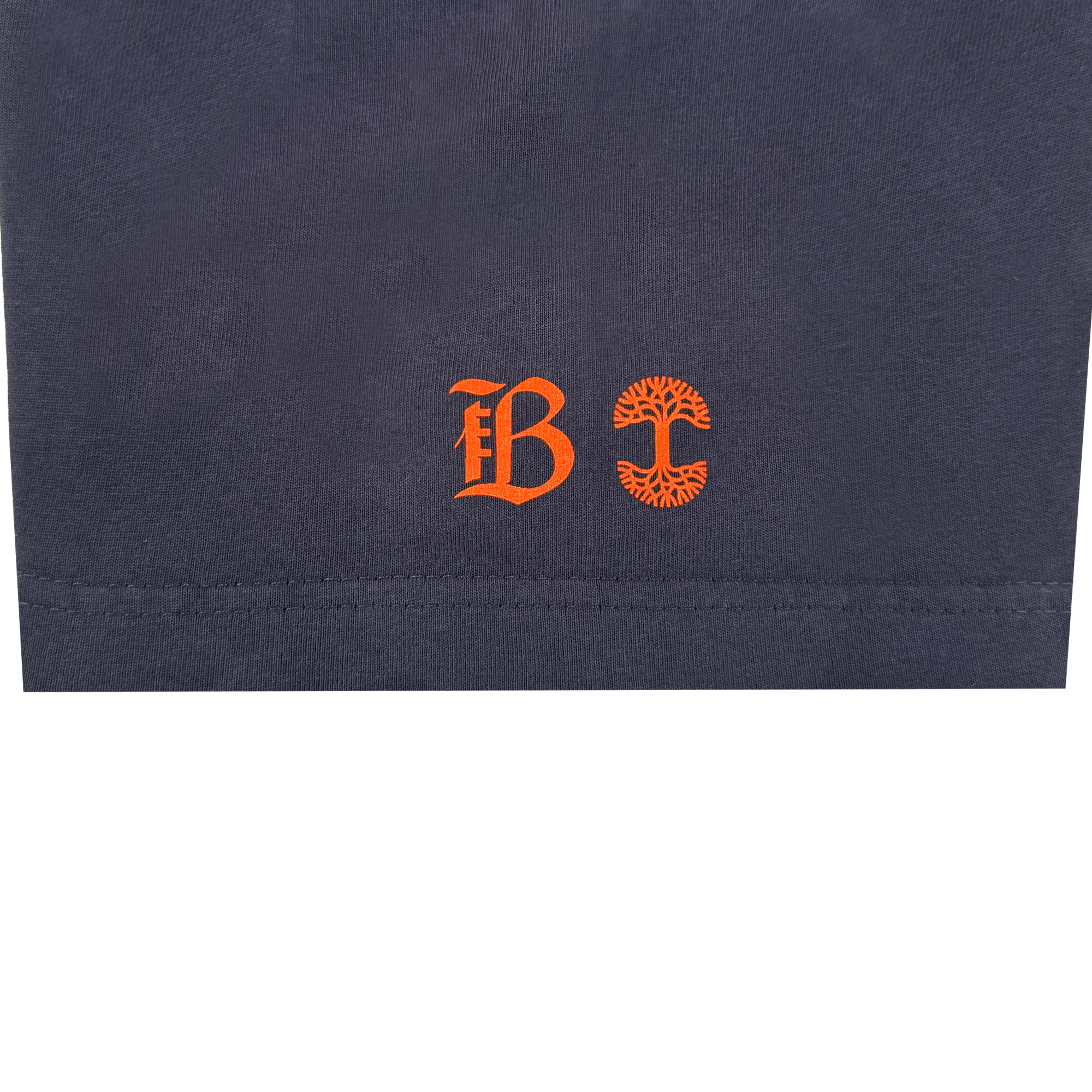 The Bay FC Varsity Tee is a navy blue, heavy-weight cotton classic fit t-shirt featuring two orange symbols—a Gothic "B" and a circular, tree-like "C"—by Bay FC’s iconic emblems.