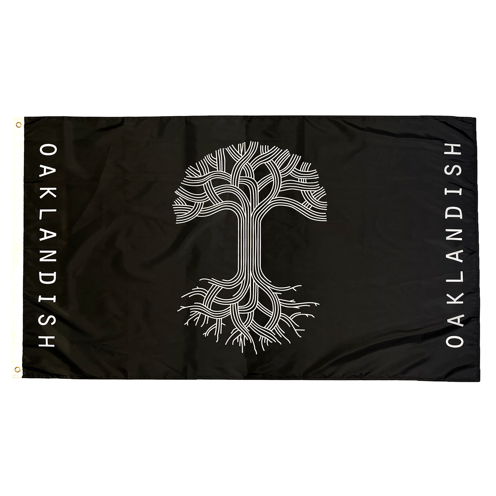 The Oaklandish Classic Logo Flag by Oaklandish features a rectangular black background with a striking white tree design at its center. The intricate branches extend to the flag's edges, and "OAKLANDISH" is boldly written vertically along both the left and right sides in white letters. Made from knit polyester, this flag includes two gold grommets on the left side for easy hanging.