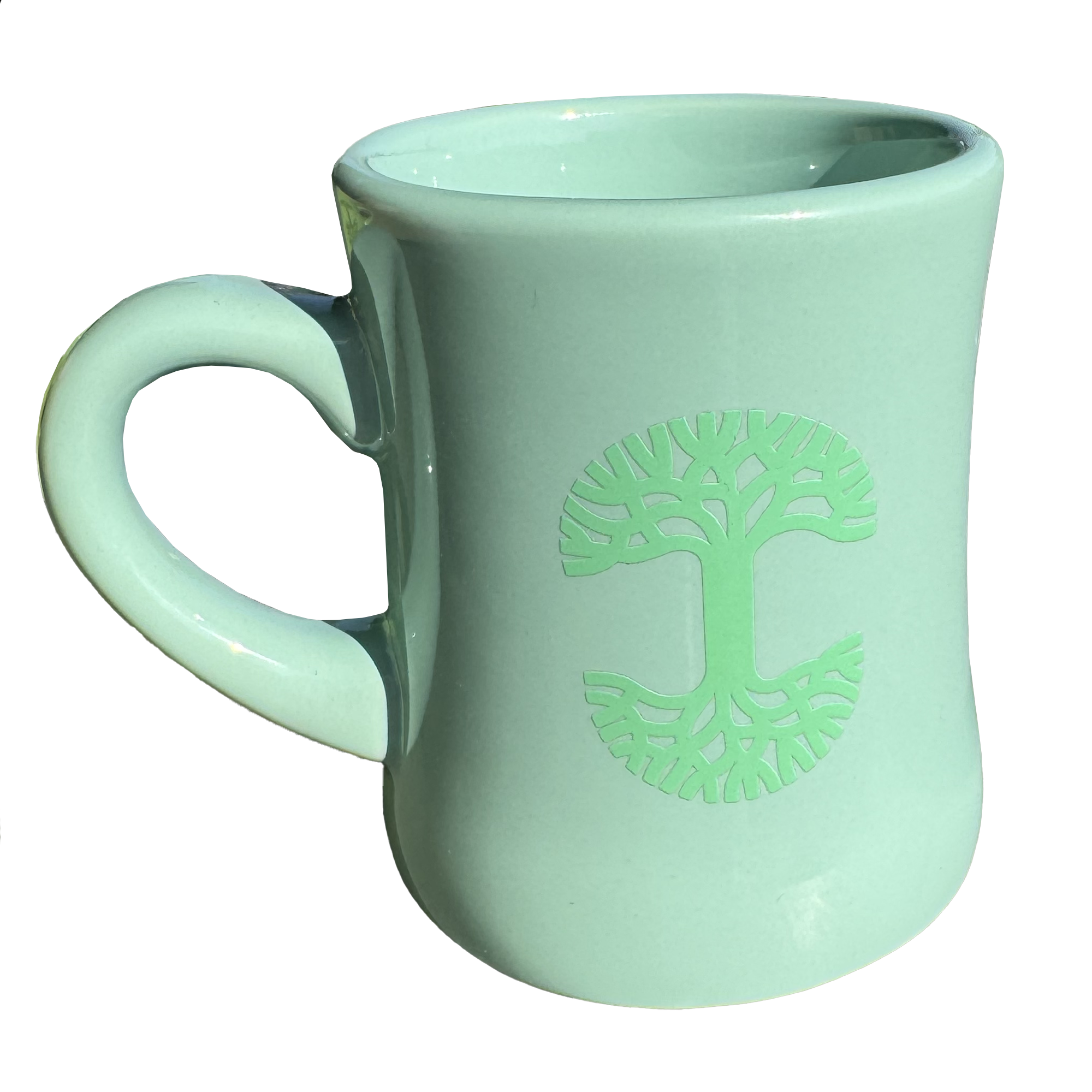 The Oaklandish Diner Mug by Oaklandish is a light green ceramic mug that boasts a stylized tree design embossed on one side. The symmetrical branches and roots of the tree form a circle, adding charm to the drinkware. Its curvy, slightly tapered shape and large handle stand out against a plain white background.