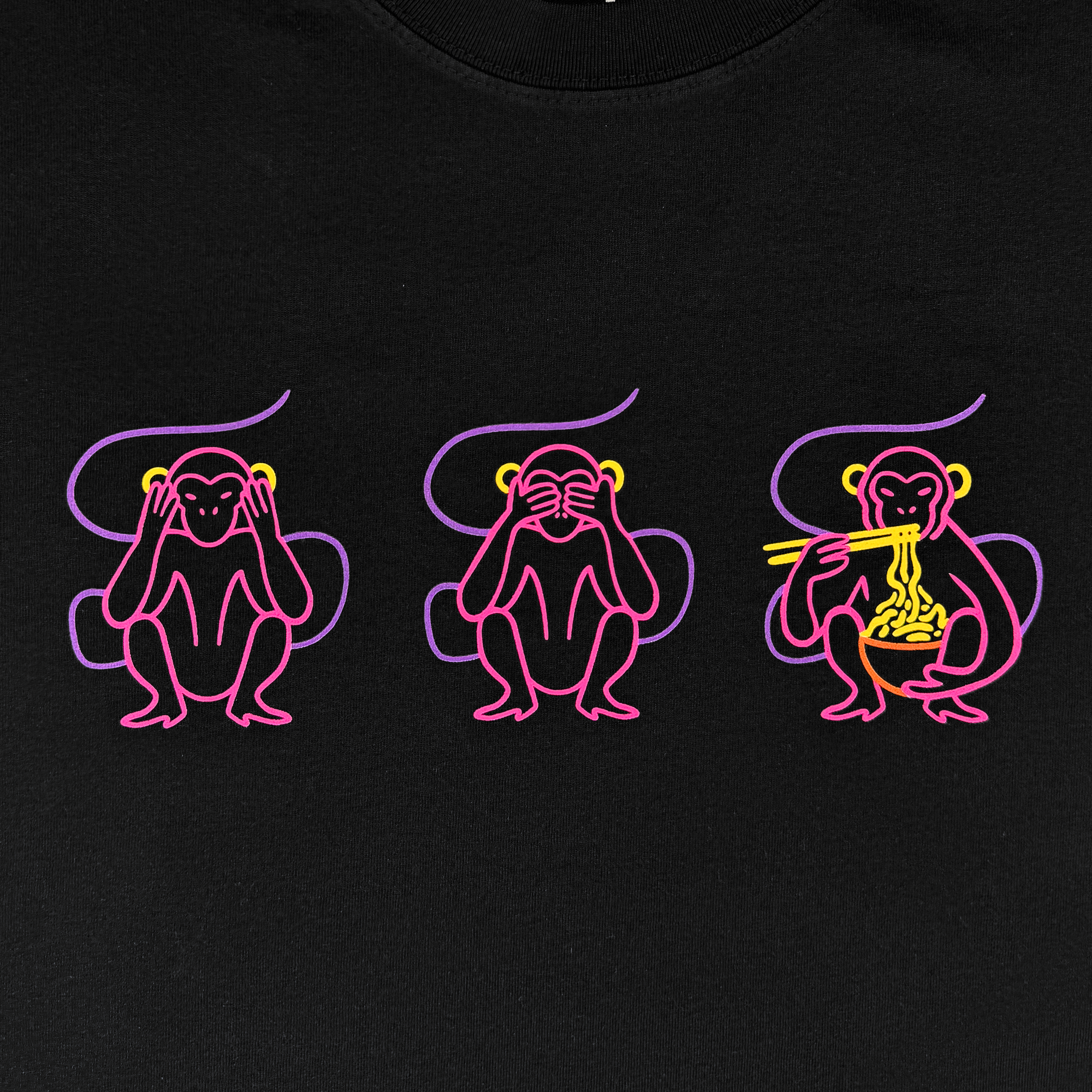 Three stylized monkeys in pink and yellow on black—a nod to "see no evil"—feature on the Jo's Modern Thai X Oaklandish Tee by Oaklandish. One covers ears, one covers eyes, and one enjoys noodles with chopsticks.