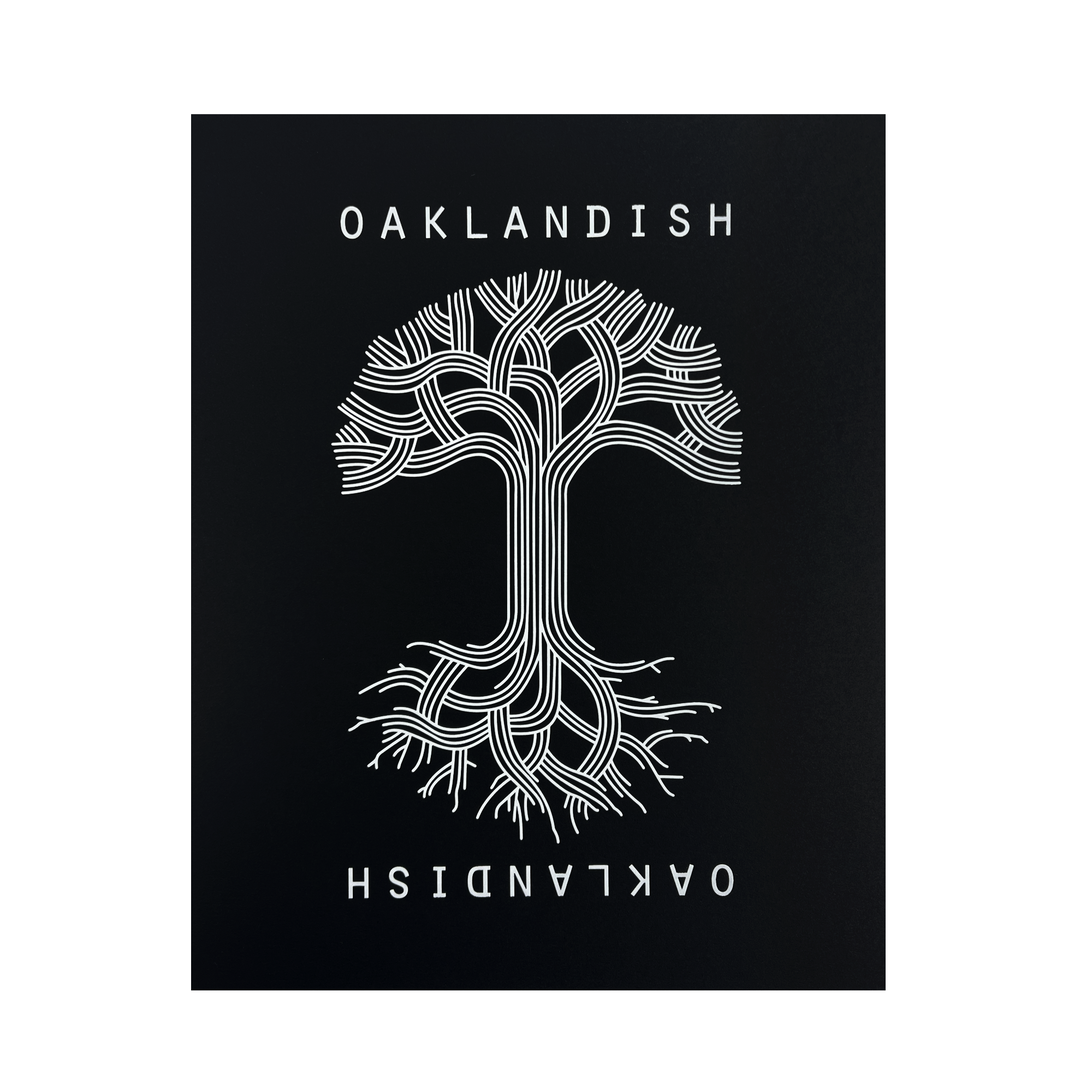 A symmetrical tree with branched lines forming roots and branches is centered against a black background in the Oaklandish Classic Logo Print by Never Elsewhere. The white text "OAKLANDISH" appears above and below the tree, with the lower text inverted. The design has a modern, graphical look reminiscent of a letterpress print, creating a striking contrast.