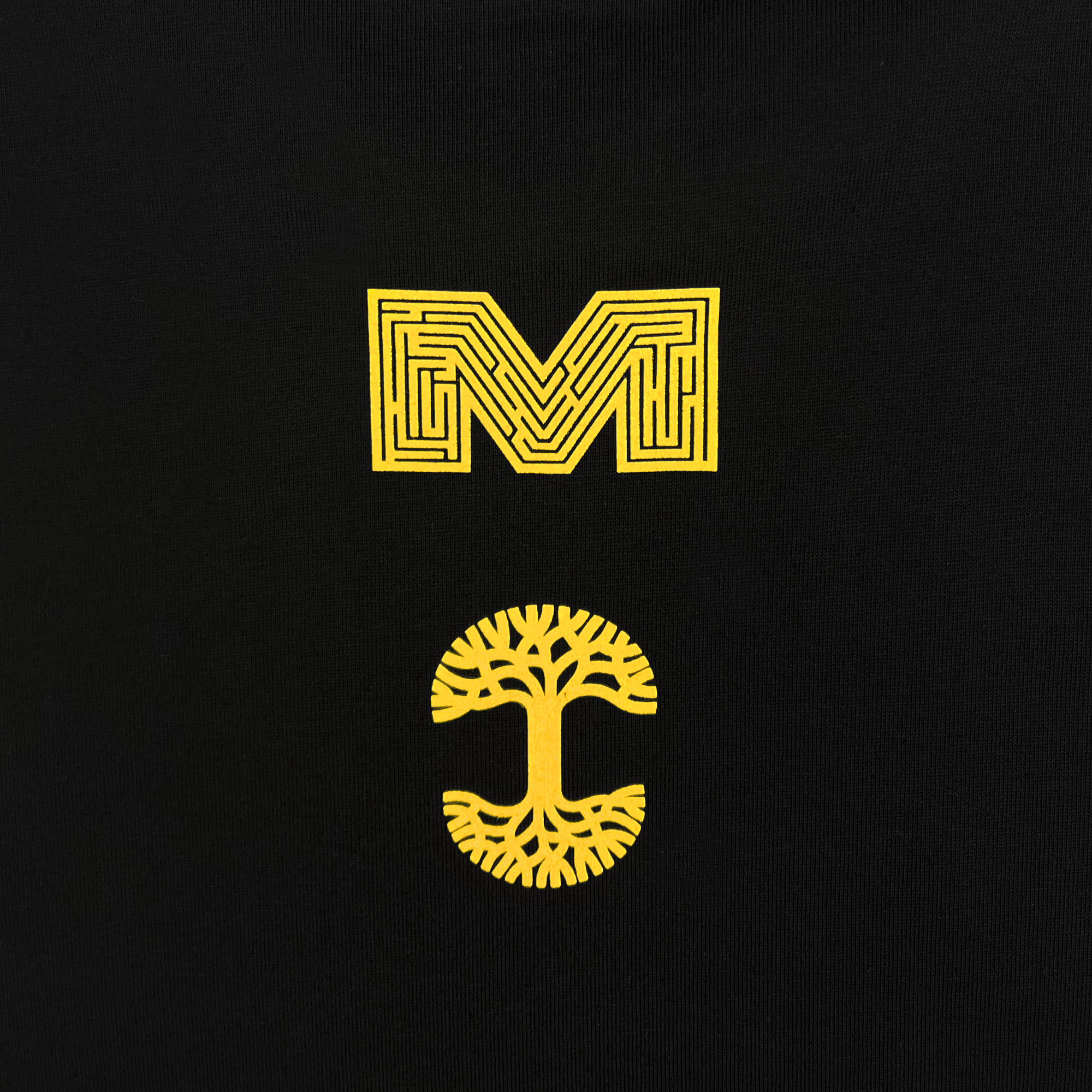 Back detail of black long sleeve t-shirt with Macarthur Maze and Oaklandish tree logo.